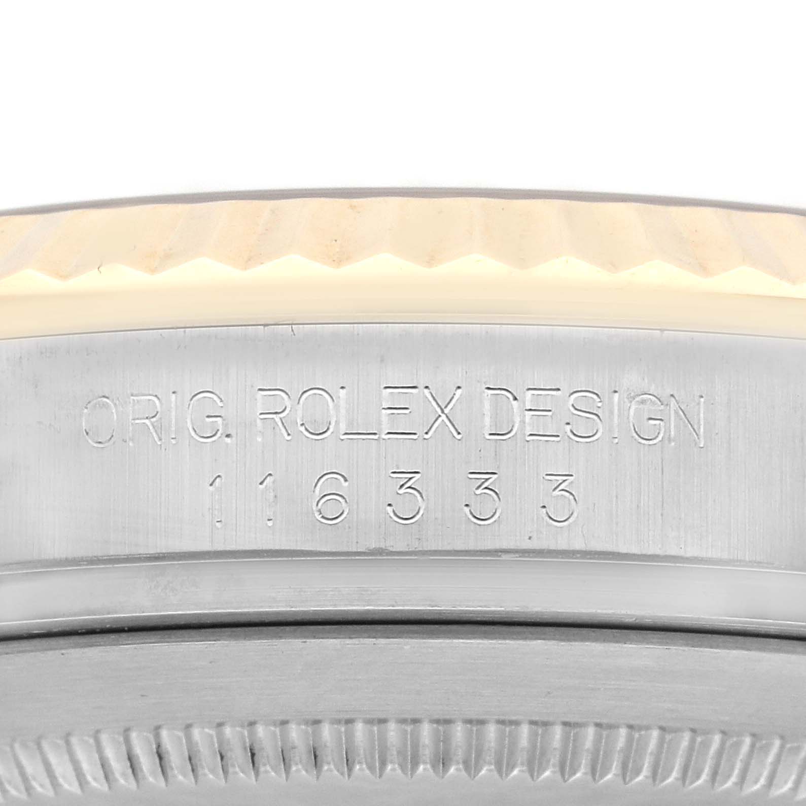 The image shows a close-up of the engraved inner bezel of a Rolex Datejust 41 116333 Men's Steel and Gold (two tone) Silver Dial 116333 Men's Steel and Gold (two tone) Silver Dial watch.