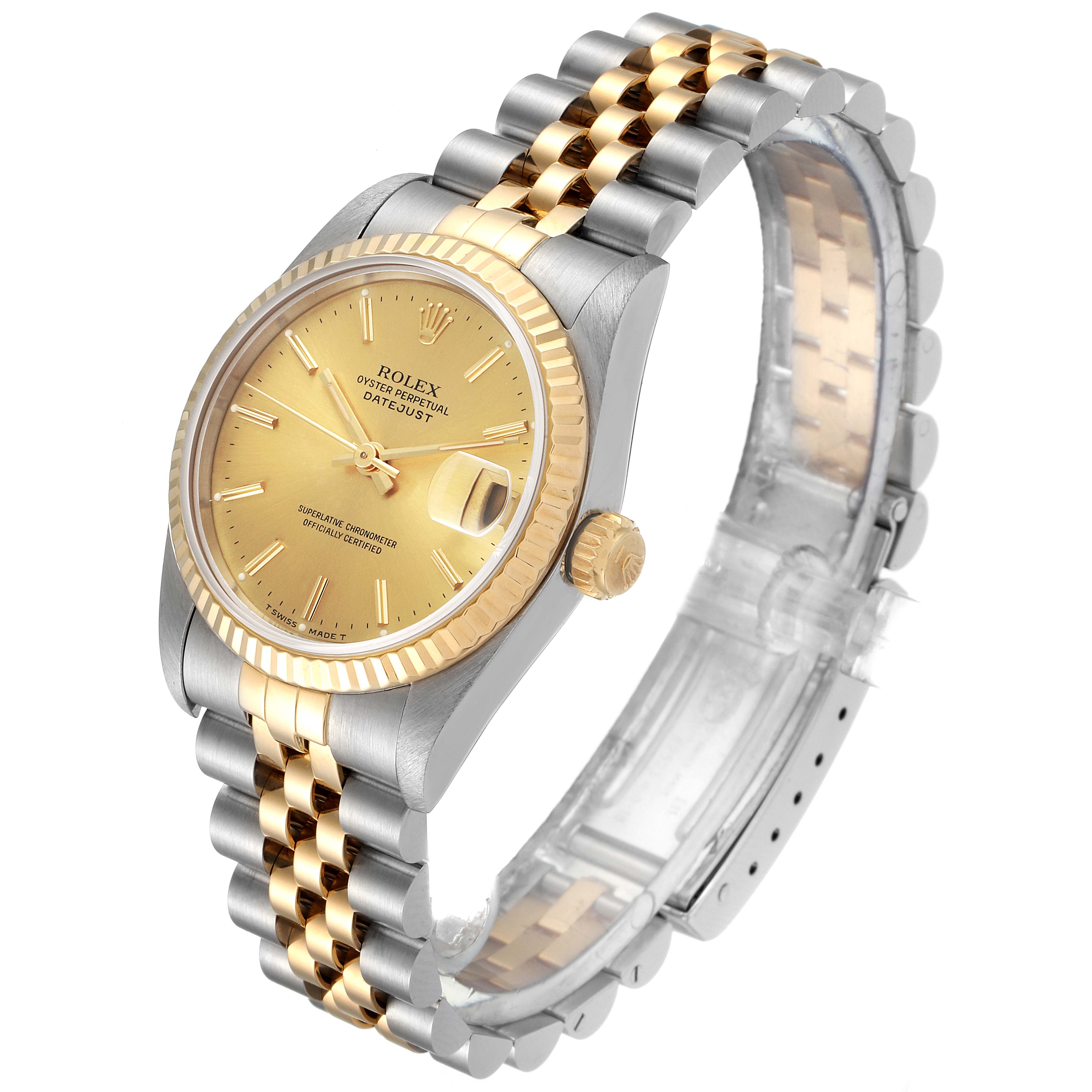 The image displays a Rolex Mid-Size 68273 Women's Steel and Gold (two tone) Champagne Dial 68273 Women's Steel and Gold (two tone) Champagne Dial Datejust watch at an angled view, showcasing its gold dial, fluted bezel, and two-tone bracelet.