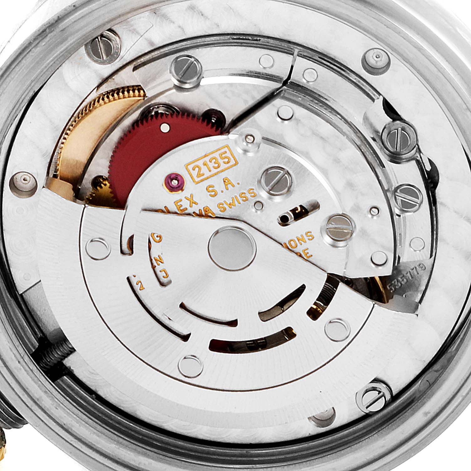 This image shows a close-up of the internal mechanism of a Mid-Size Rolex watch, highlighting its intricate moving parts.