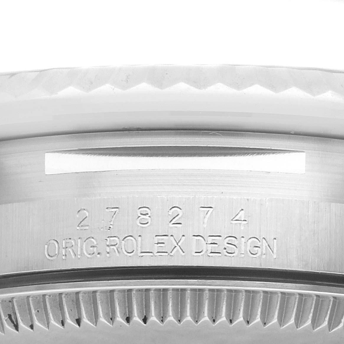This close-up shows the side engraving and bezel of a Rolex Mid-Size 278274 Women's Stainless Steel Green Dial 278274 Women's Stainless Steel Green Dial model watch.