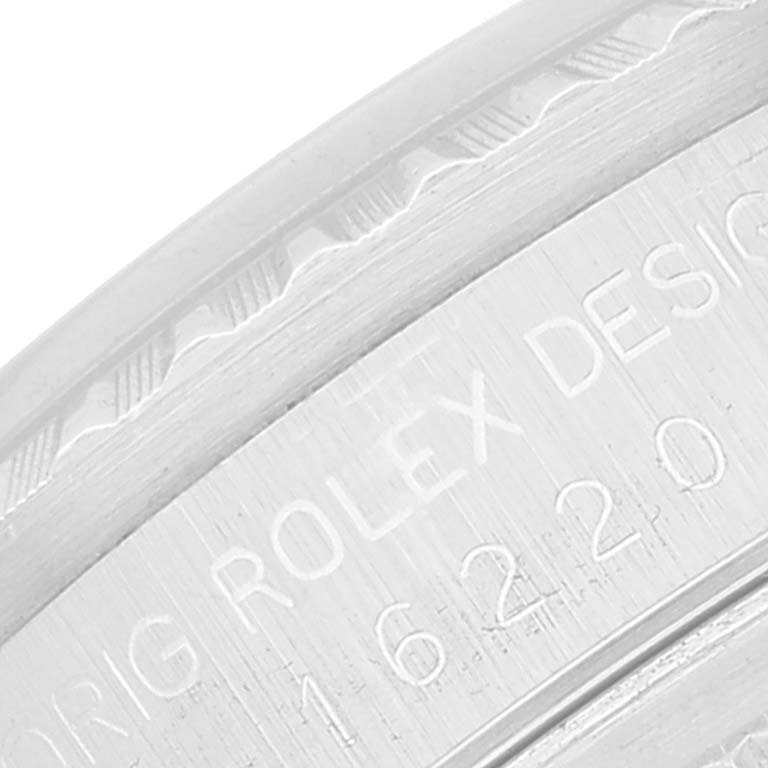 The image shows a close-up of the engraved side of a Rolex Datejust 16220 Men's Stainless Steel Silver Dial 16220 Men's Stainless Steel Silver Dial watch case, highlighting its model number and brand inscription.