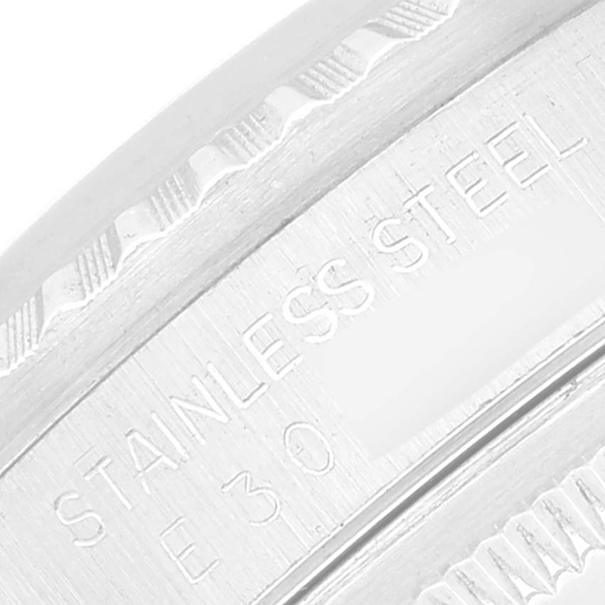 This image shows a close-up of the engraved inner bezel of a Rolex Datejust 16220 Men's Stainless Steel Silver Dial 16220 Men's Stainless Steel Silver Dial watch, highlighting "STAINLESS STEEL."