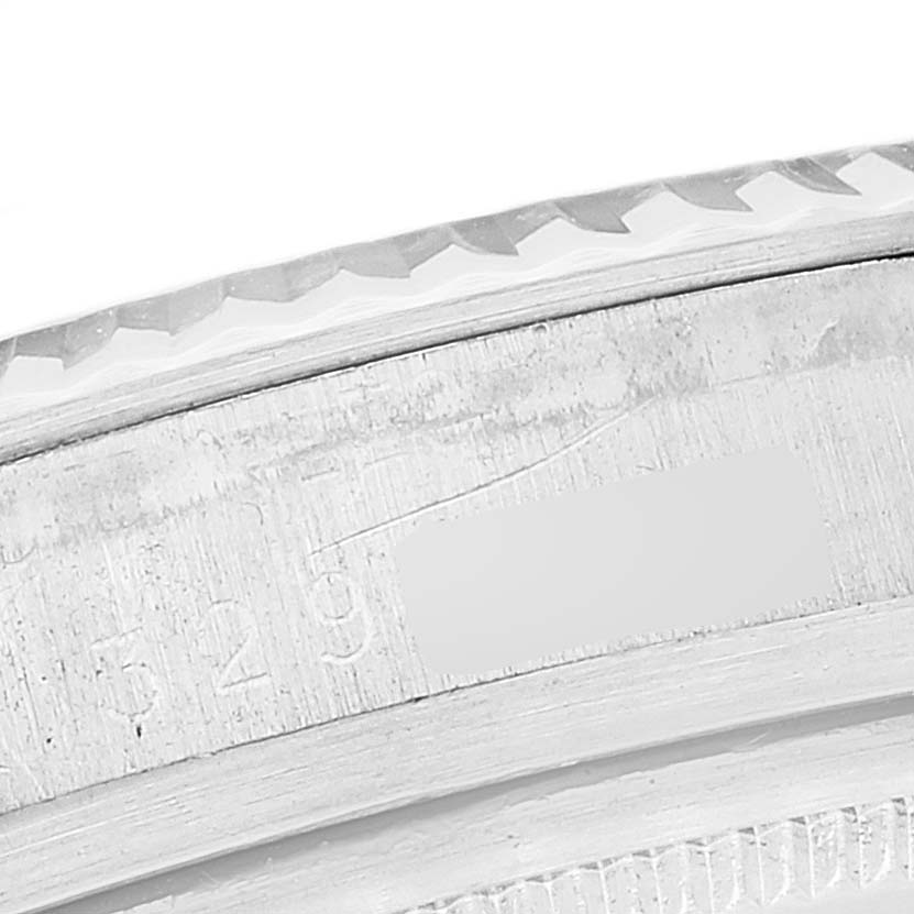 The image shows a close-up of the engraved bezel on a Rolex Vintage Collection 1601 Men's Stainless Steel Black Dial 1601 Men's Stainless Steel Black Dial watch.