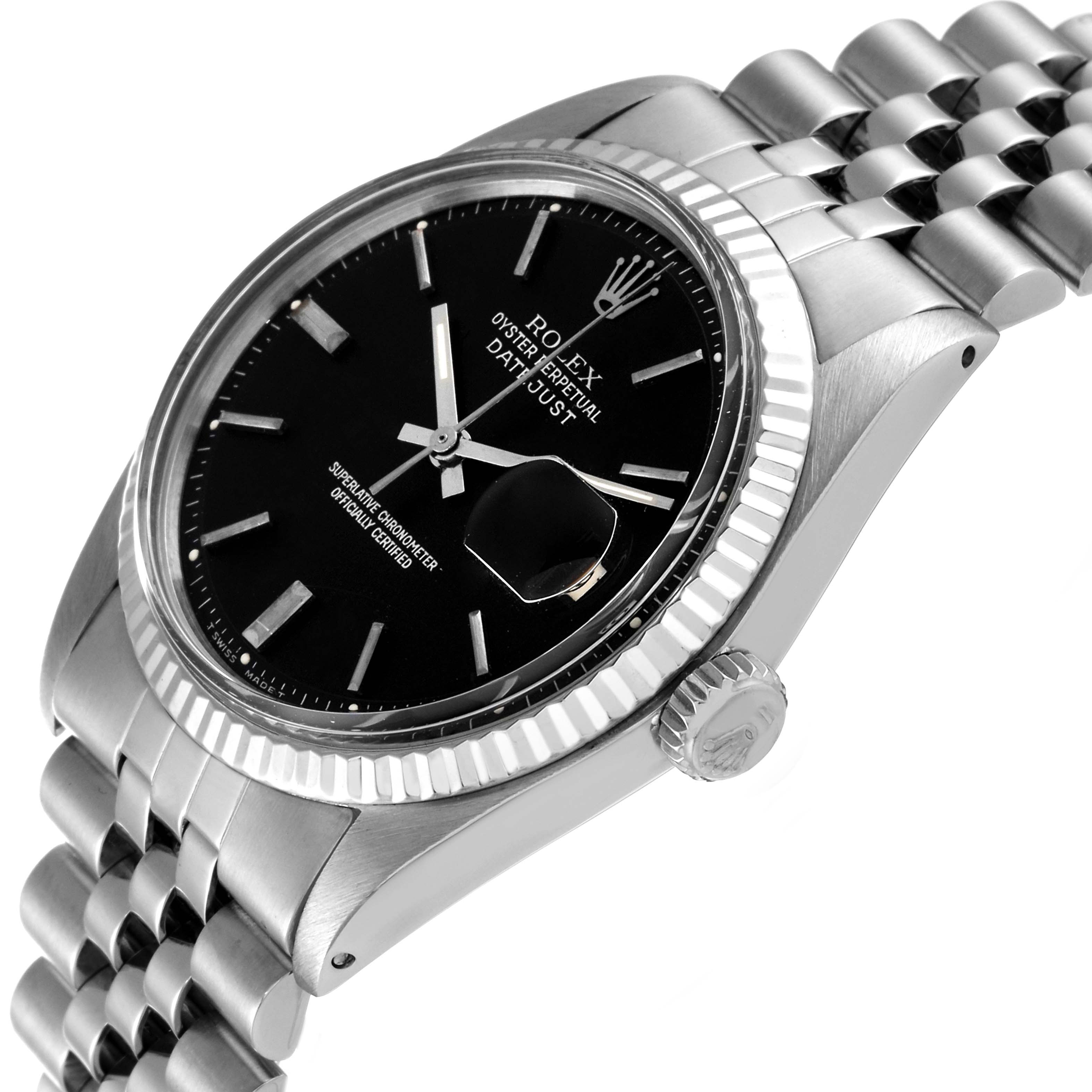 This image shows a side angle view of the Rolex Vintage Collection 1601 Men's Stainless Steel Black Dial 1601 Men's Stainless Steel Black Dial Datejust watch, highlighting its black dial, bezel, and crown.