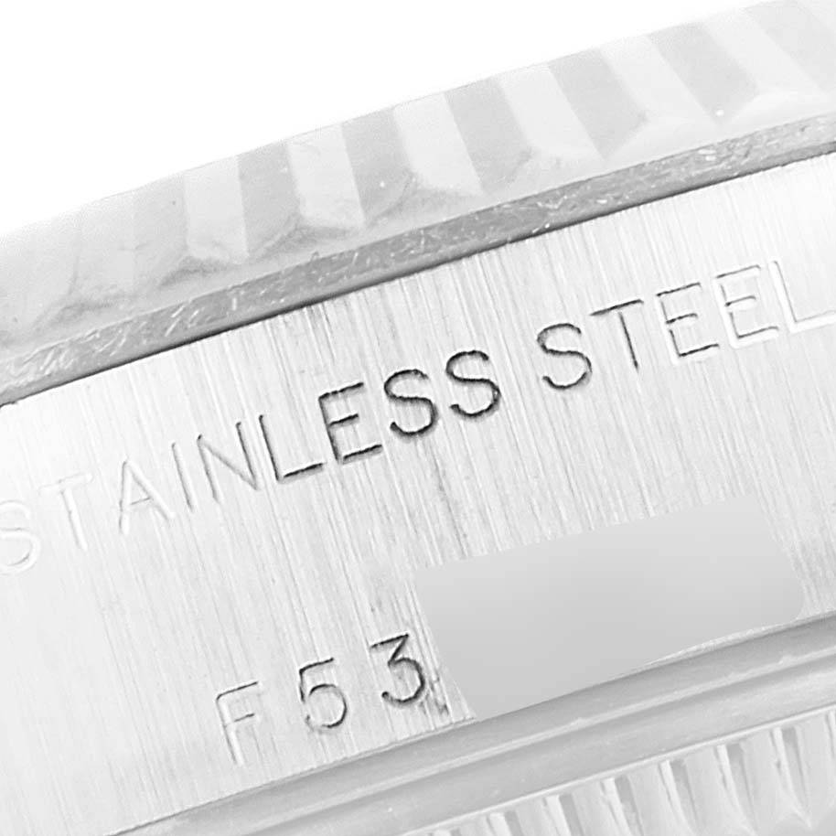This close-up image shows the engravings on the stainless steel side of a Rolex Datejust 79174 Women's Stainless Steel Silver Dial 79174 Women's Stainless Steel Silver Dial watch case.