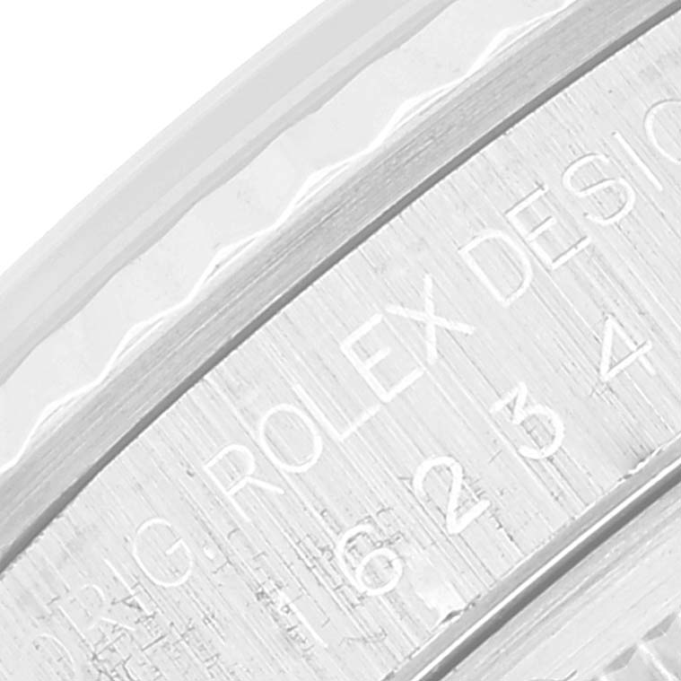 The image shows an engraved text on the inner bezel ring of a Rolex Datejust 16234 Men's Stainless Steel Silver Dial 16234 Men's Stainless Steel Silver Dial watch.