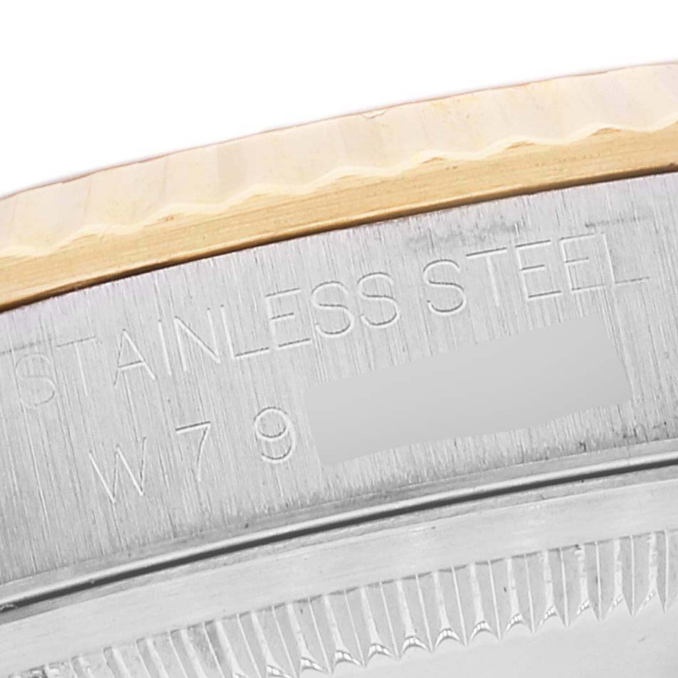 This image shows a close-up of the serial number and stainless steel marking on a Rolex Datejust 16233 Men's Steel and Gold (two tone) Champagne Dial 16233 Men's Steel and Gold (two tone) Champagne Dial watch case.