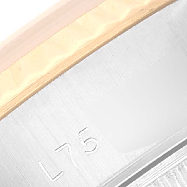This close-up image shows the edge of the bezel and case, featuring some engraved markings on the Rolex Datejust 69173 Women's Steel and Gold (two tone) Champagne Dial 69173 Women's Steel and Gold (two tone) Champagne Dial watch.