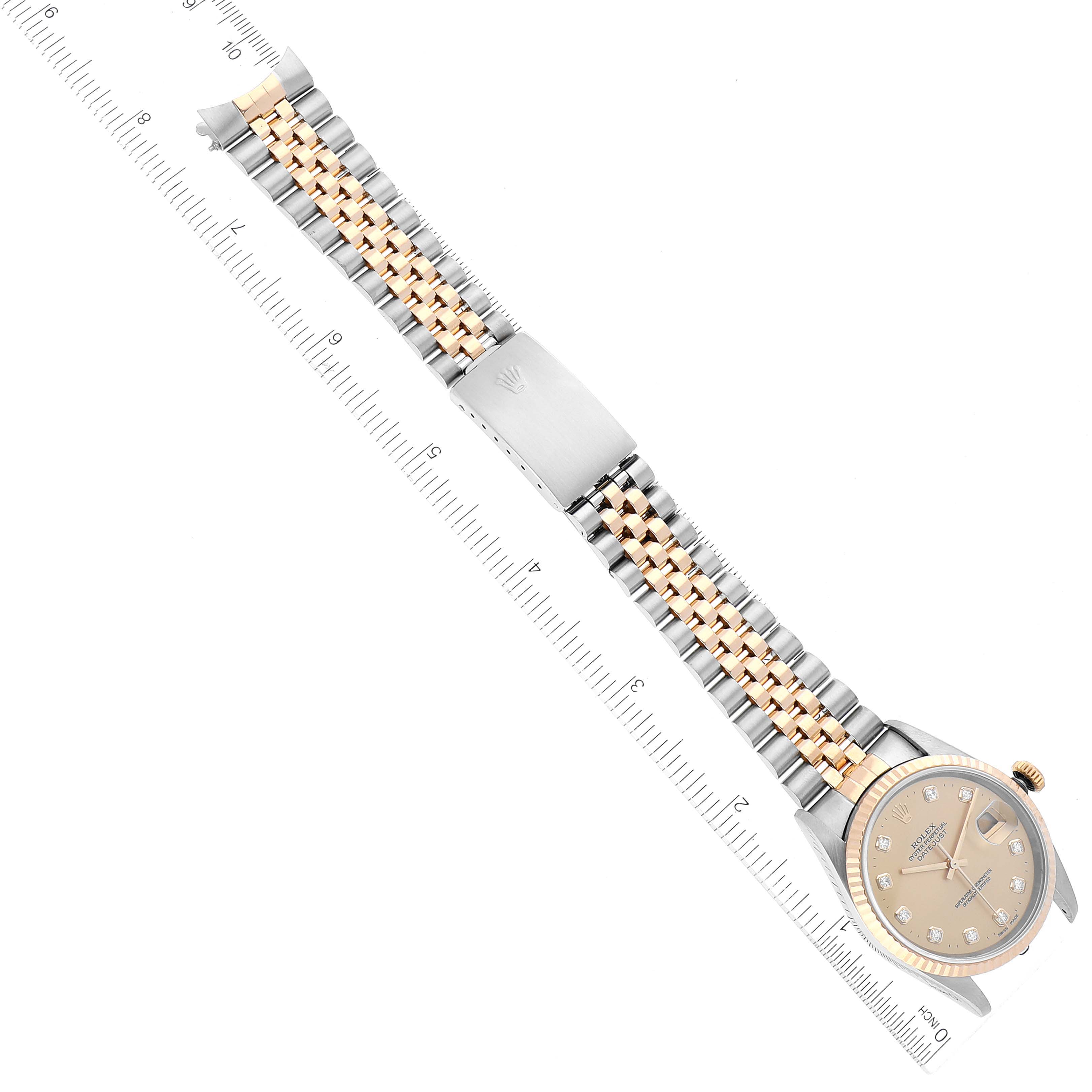 The image shows a top-down view of a Rolex Datejust 16233 Men's Steel and Gold (two tone) Champagne Dial 16233 Men's Steel and Gold (two tone) Champagne Dial watch, highlighting the watch face, bezel, and metal bracelet with a ruler.