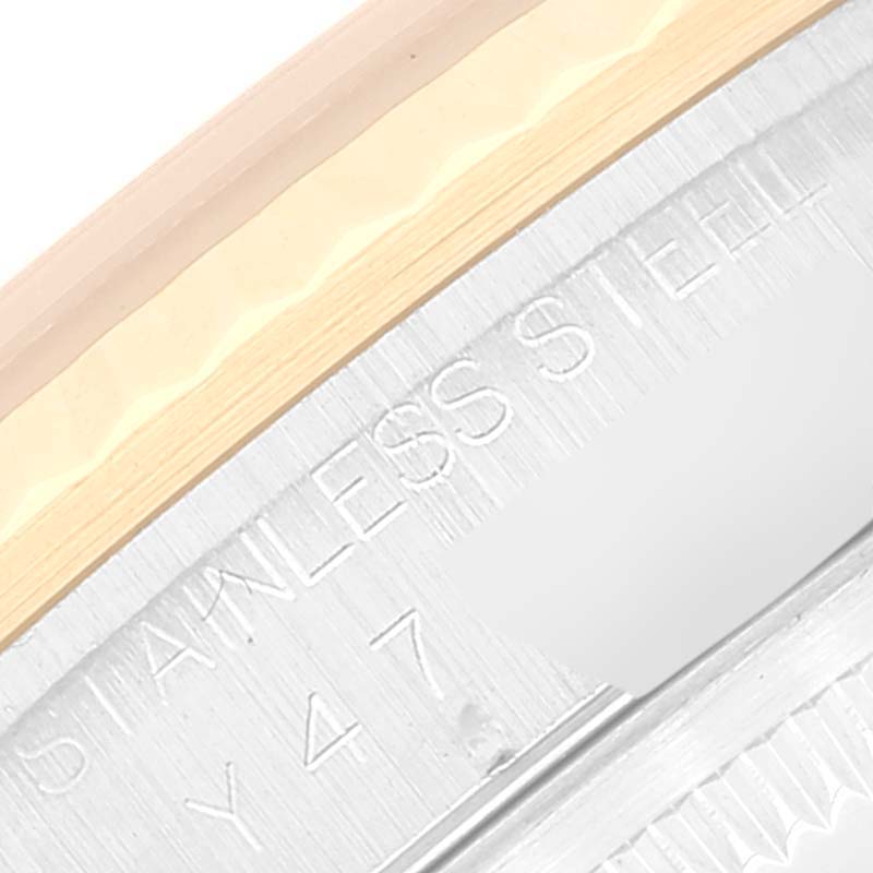 This close-up image shows the engraved text "STAINLESS STEEL" on the casing of a Rolex Datejust 16233 Men's Steel and Gold (two tone) Champagne Dial 16233 Men's Steel and Gold (two tone) Champagne Dial watch.