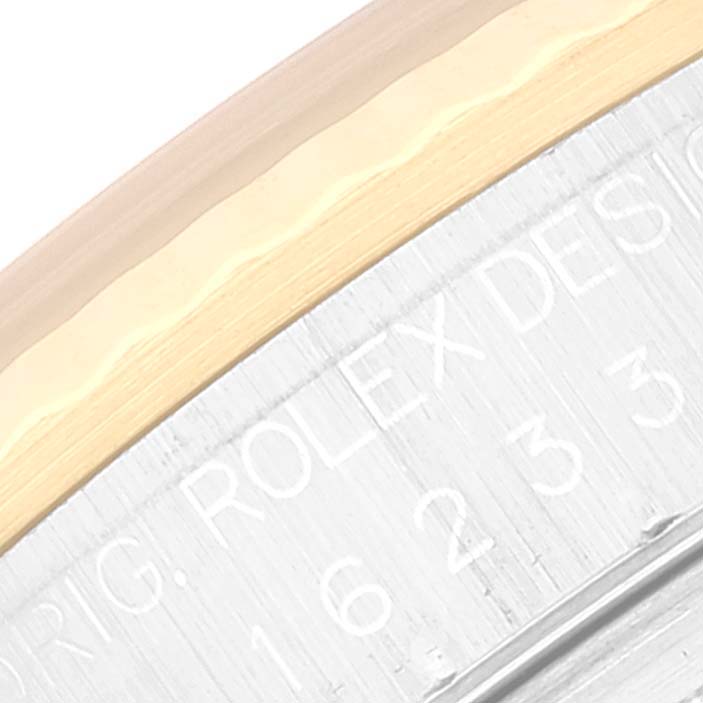 The image shows a close-up of the Rolex Datejust 16233 Men's Steel and Gold (two tone) Champagne Dial 16233 Men's Steel and Gold (two tone) Champagne Dial's bezel and the engraved model number.
