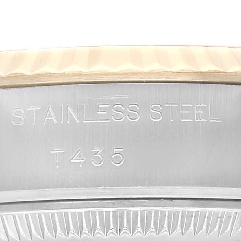 The image shows a close-up of the stainless steel case back edge of a Rolex Datejust 69173 Women's Steel and Gold (two tone) Silver Dial 69173 Women's Steel and Gold (two tone) Silver Dial watch with the model number T435.