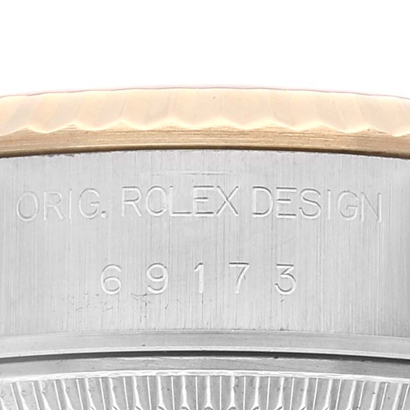 This close-up image shows part of the case side with the model number of the Rolex Datejust 69173 Women's Steel and Gold (two tone) Silver Dial 69173 Women's Steel and Gold (two tone) Silver Dial watch.