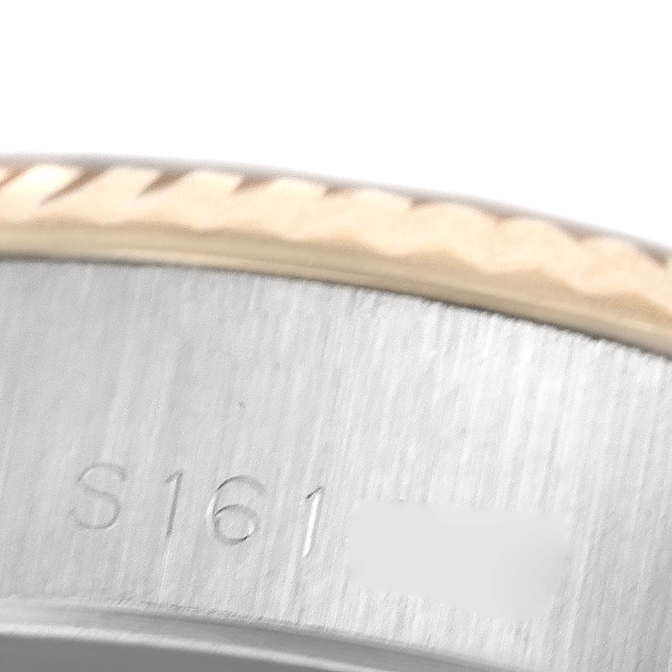 This image shows a close-up of the bezel and serial number of a Rolex Datejust 69173 Women's Steel and Gold (two tone) White Dial 69173 Women's Steel and Gold (two tone) White Dial watch.