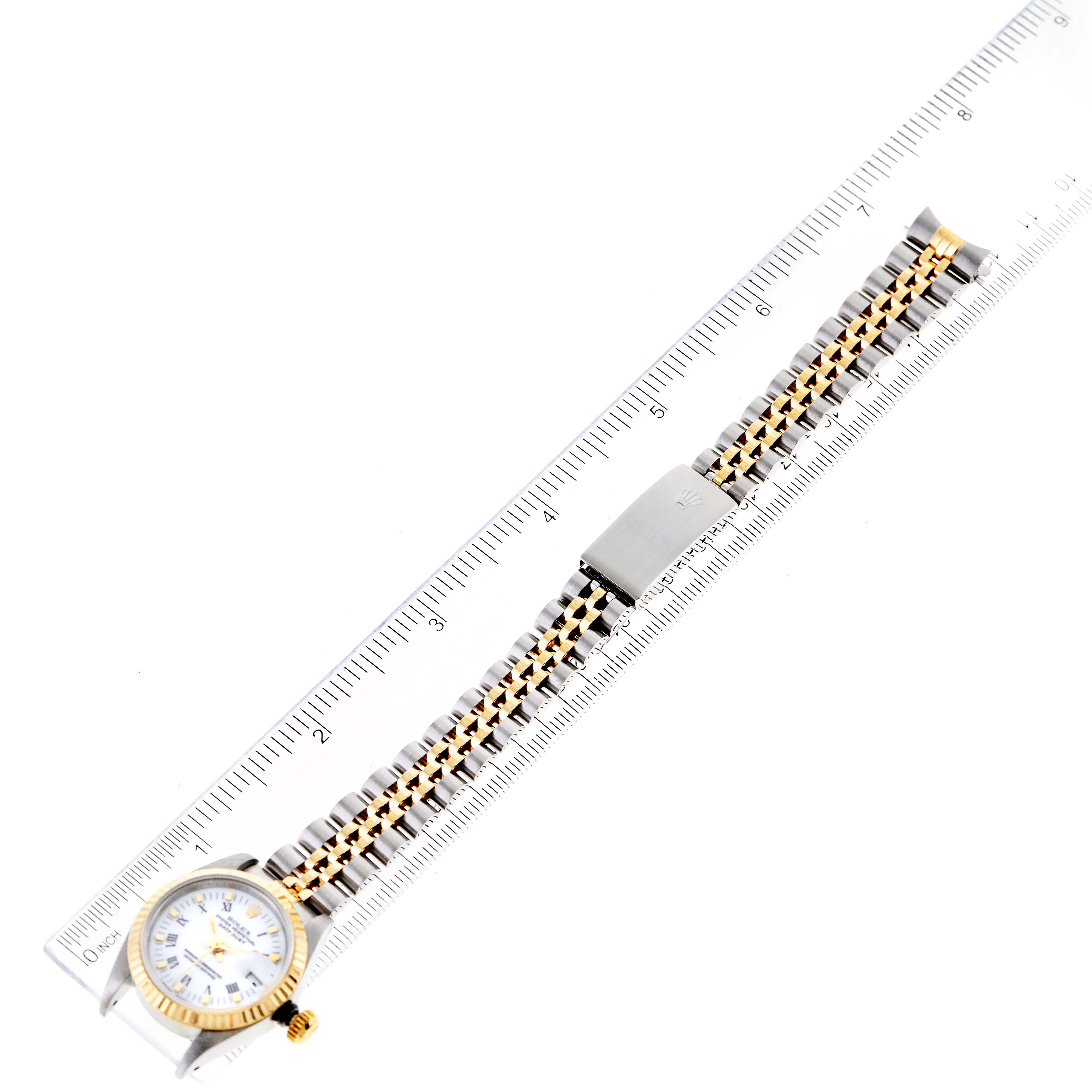 The image shows a Rolex Datejust 69173 Women's Steel and Gold (two tone) White Dial 69173 Women's Steel and Gold (two tone) White Dial watch laying flat with a ruler for scale.