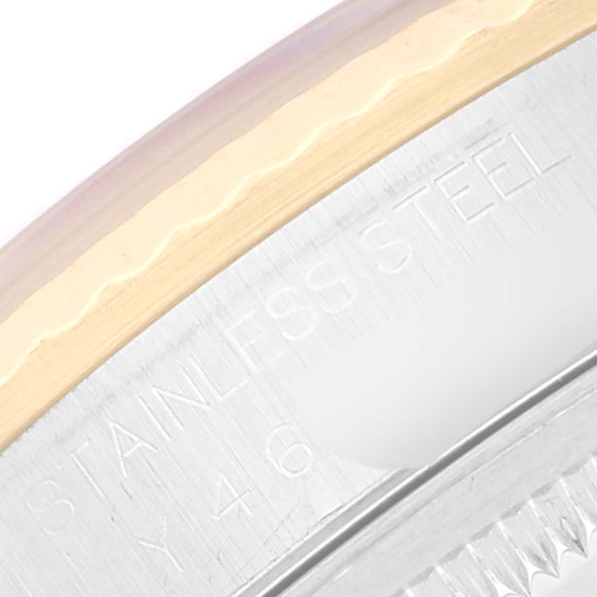 The image shows a close-up of the side of a Rolex Datejust 16233 Men's Steel and Gold (two tone) White Dial 16233 Men's Steel and Gold (two tone) White Dial watch, highlighting the engraved "STAINLESS STEEL" text.