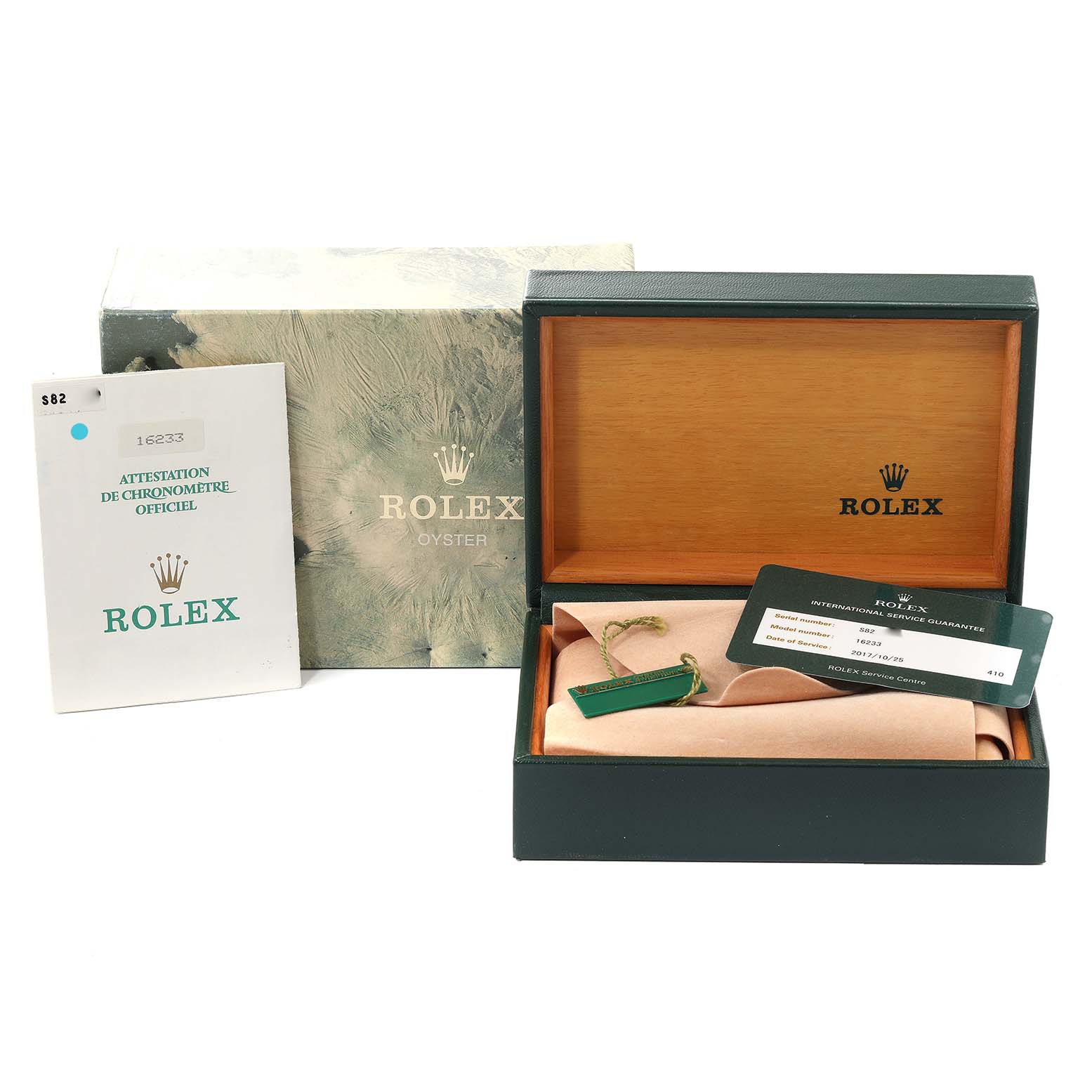 This image shows an open Rolex Datejust 16233 Men's Steel and Gold (two tone) White Dial 16233 Men's Steel and Gold (two tone) White Dial box, guarantee card, and certification booklet.