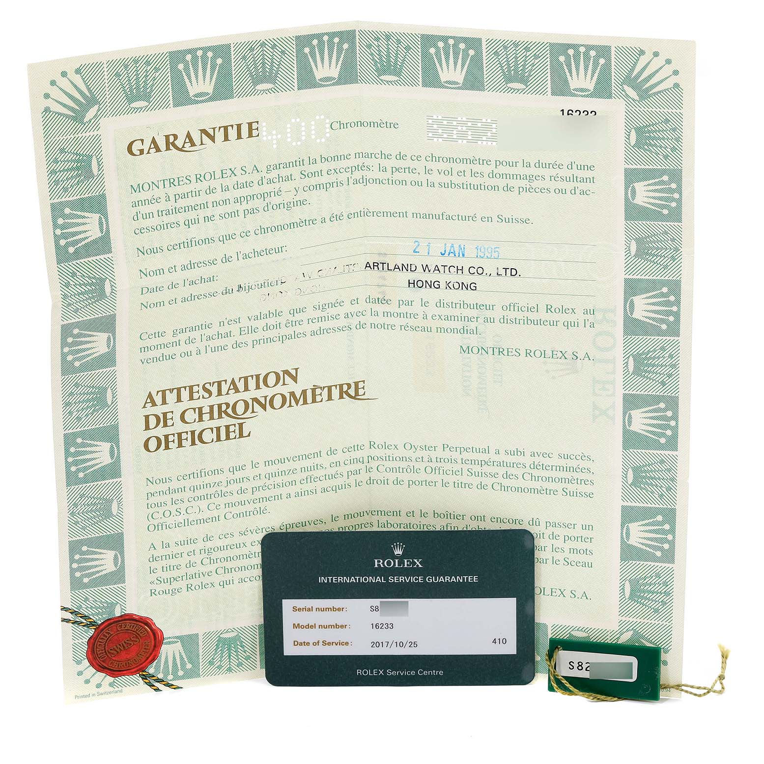 The image shows warranty papers and an international service guarantee card for a Rolex Datejust 16233 Men's Steel and Gold (two tone) White Dial 16233 Men's Steel and Gold (two tone) White Dial model 16233 watch.