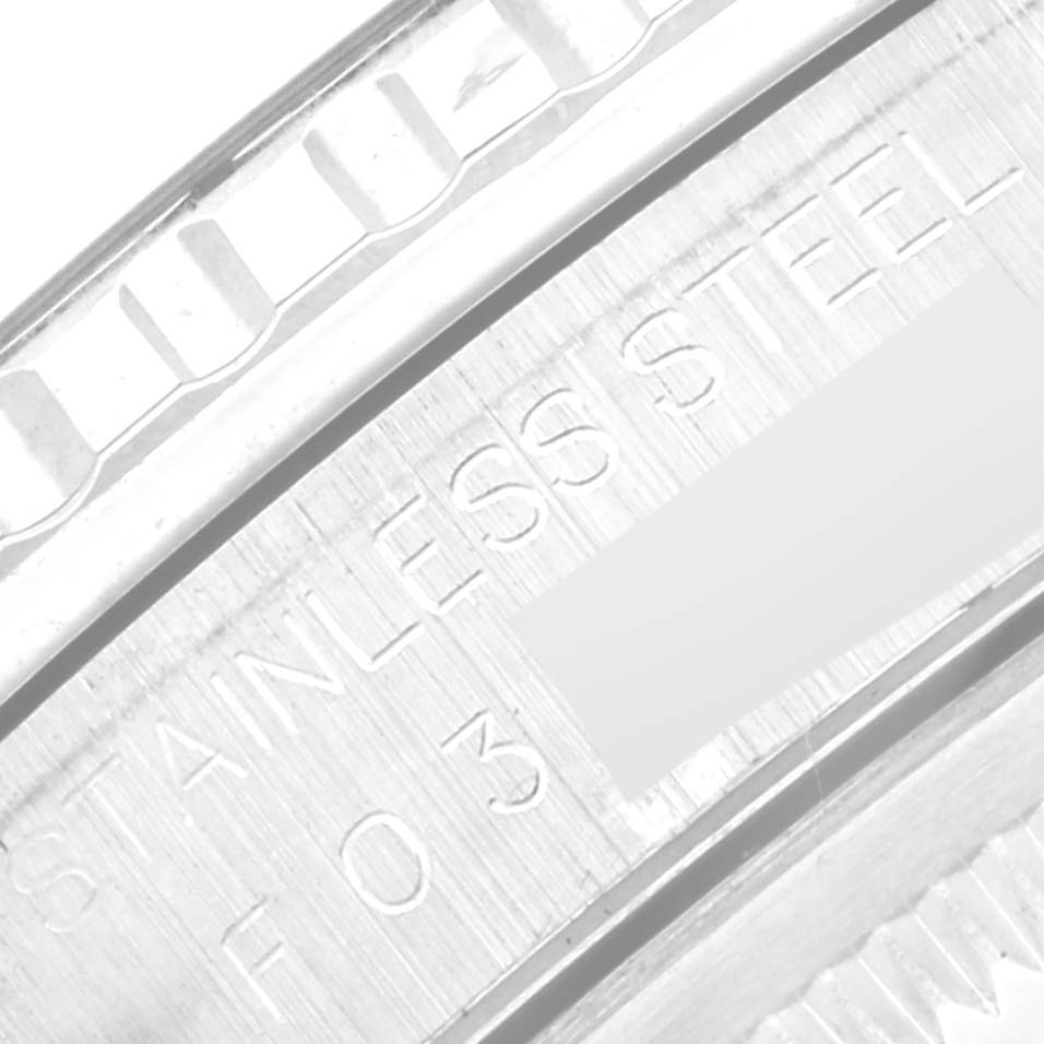 This close-up image of the Rolex Turn-o-Graph 16264 Men
s Stainless Steel Blue Dial 16264 Men
s Stainless Steel Blue Dial model shows part of the watch
s stainless steel bezel and engraved text.