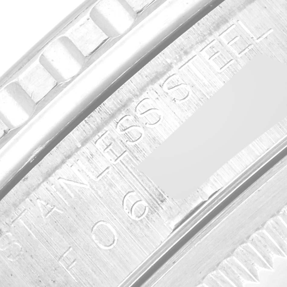 The image shows a close-up of the serial engraving and bezel of the Rolex Turn-o-Graph 16264 Men
s Stainless Steel Silver Dial 16264 Men
s Stainless Steel Silver Dial watch.