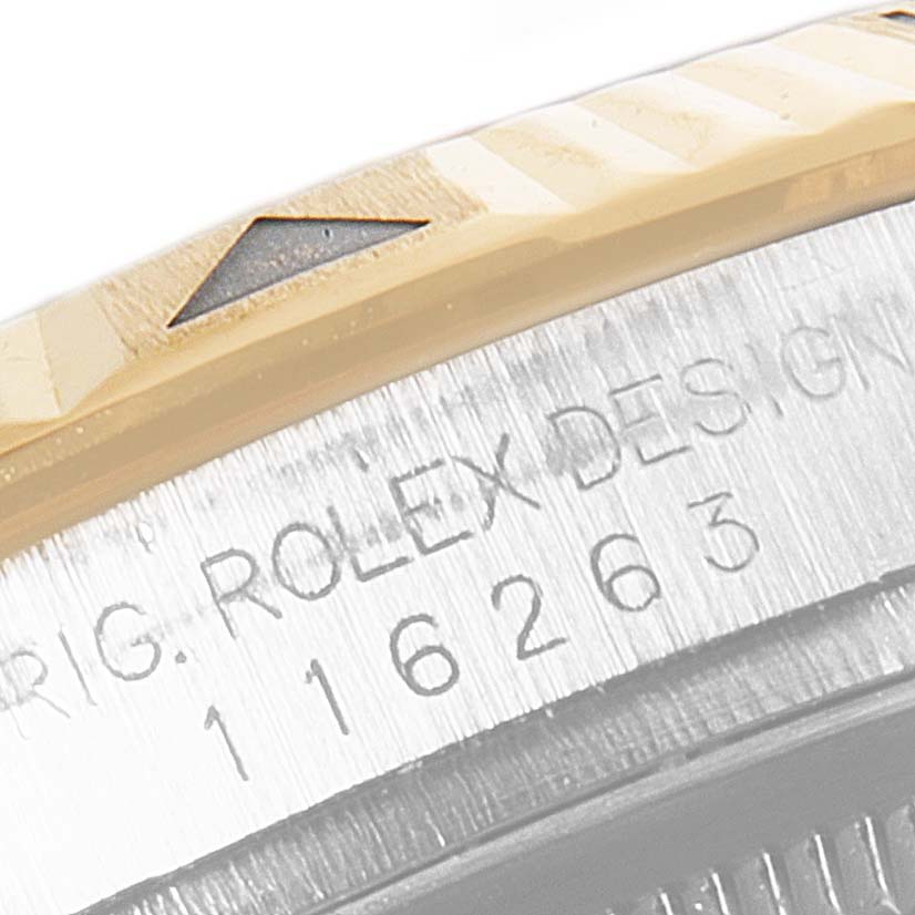 This close-up image shows the bezel and part of the casing with the serial and model number of a Rolex Turn-o-Graph 116263 Men
s Steel and Gold (two tone) White Dial 116263 Men
s Steel and Gold (two tone) White Dial.