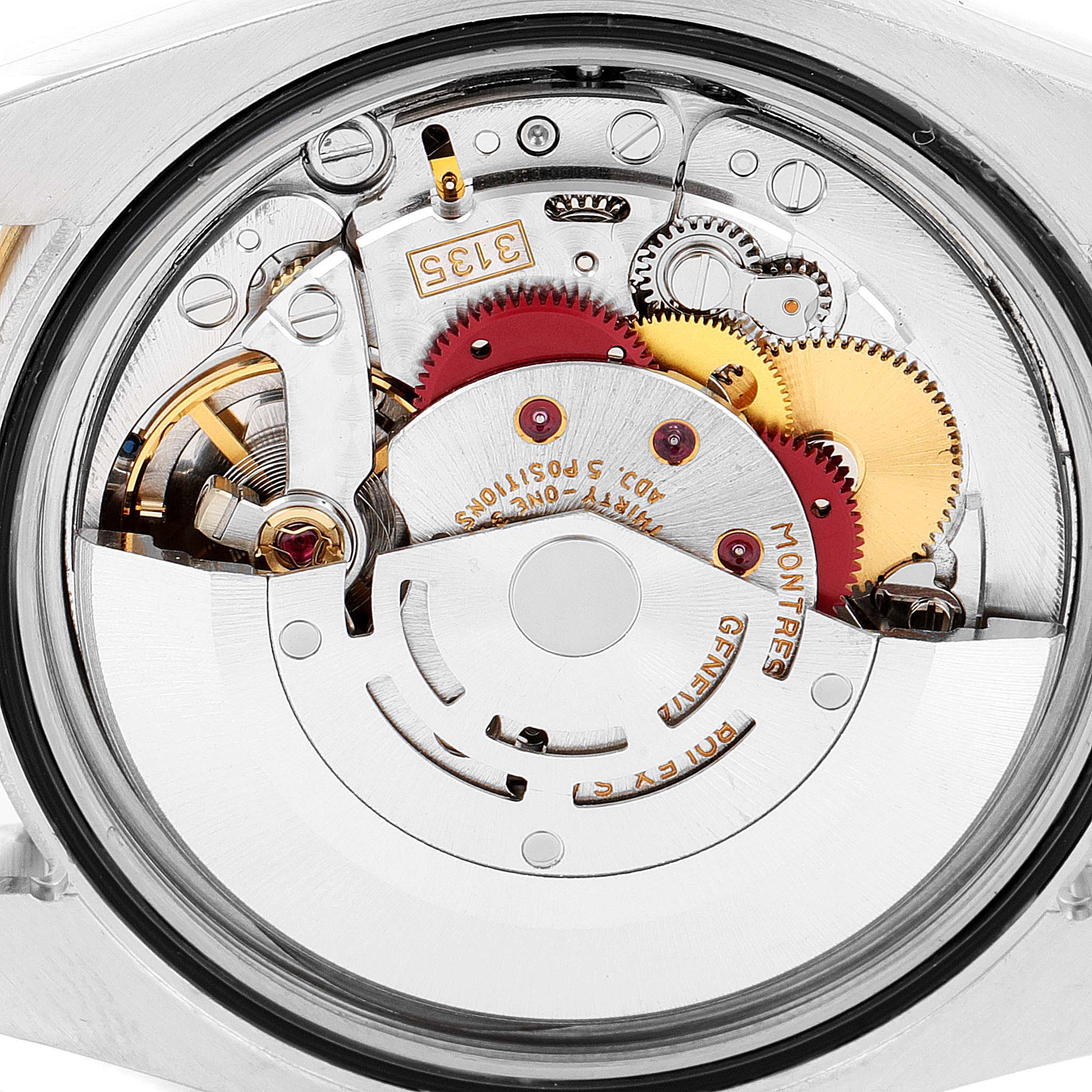 This image shows the intricate internal movement parts of the Rolex Turn-o-Graph 116263 Men
s Steel and Gold (two tone) White Dial 116263 Men
s Steel and Gold (two tone) White Dial watch from a back angle.