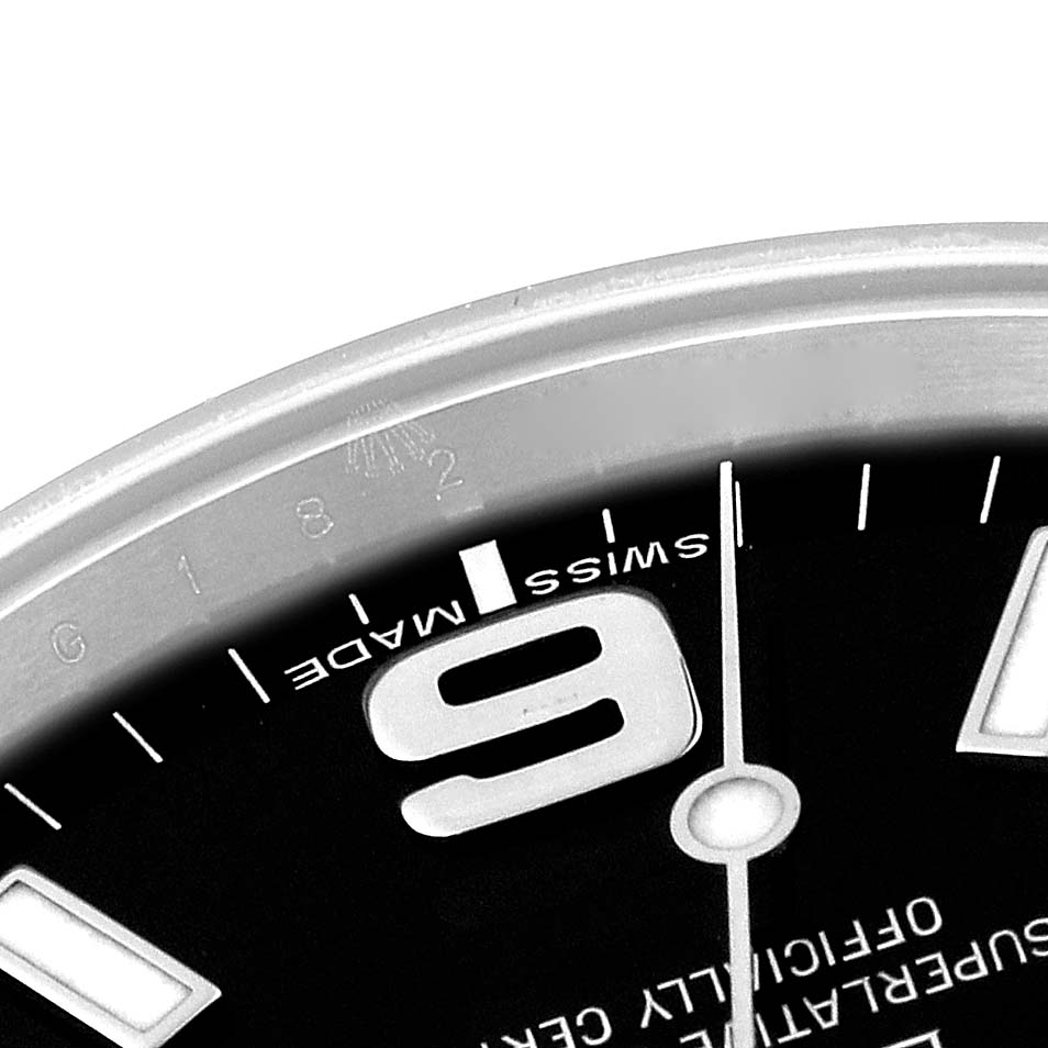 This image shows a close-up, angled view of the dial and part of the bezel of a Rolex Explorer 214270 Men
s Stainless Steel Black Dial 214270 Men
s Stainless Steel Black Dial watch.