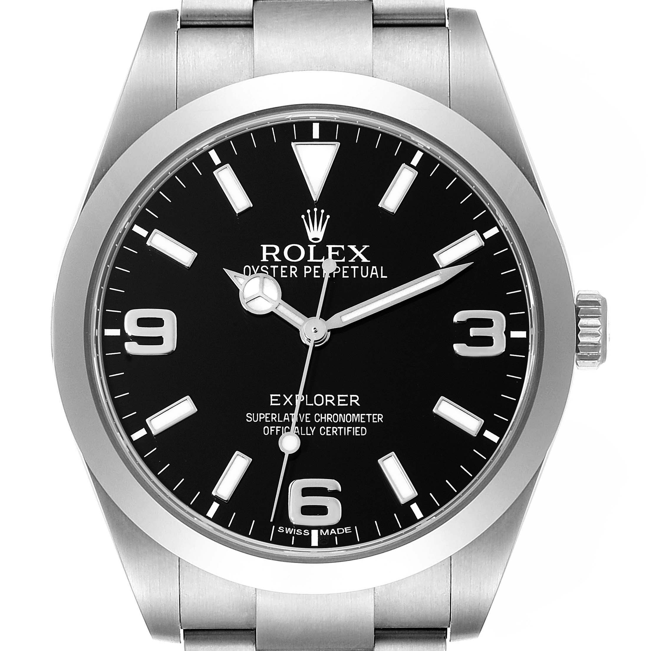 The image shows a front view of the Rolex Explorer 214270 Men
s Stainless Steel Black Dial 214270 Men
s Stainless Steel Black Dial watch, focusing on its black dial, hour markers, hands, and part of the metal bracelet.