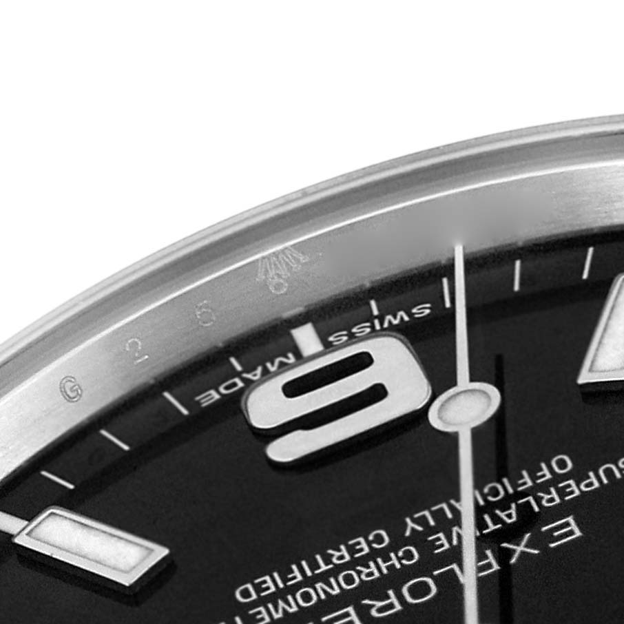 The close-up image shows a partial view of the Rolex Explorer 214270 Men's Stainless Steel Black Dial 214270 Men's Stainless Steel Black Dial watch face, highlighting the "6" marker, hands, and "Swiss Made" text.