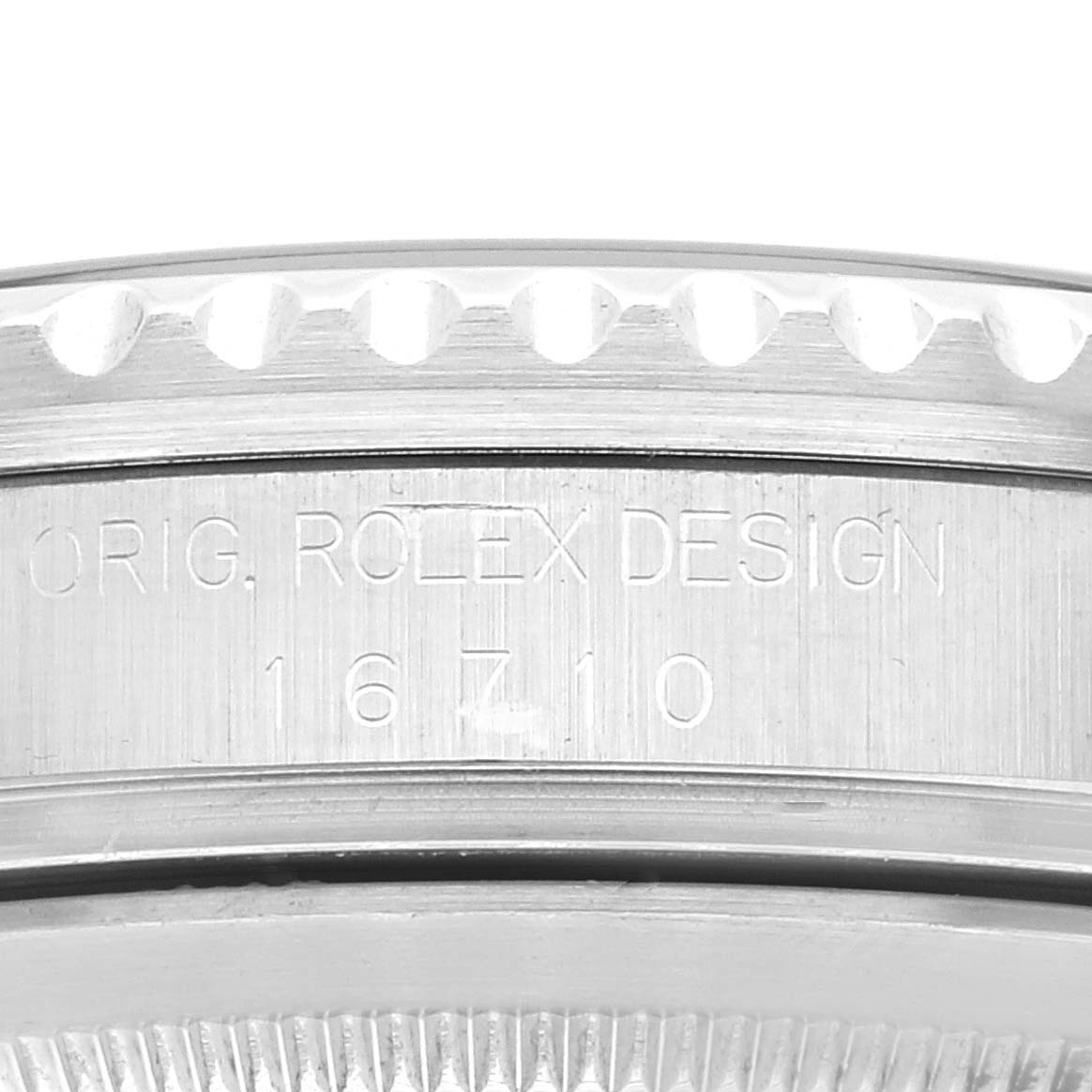 This image shows a close-up of the bezel and case side of a Rolex GMT-Master 16710 Men
s Stainless Steel Black Dial 16710 Men
s Stainless Steel Black Dial, displaying the engravings.