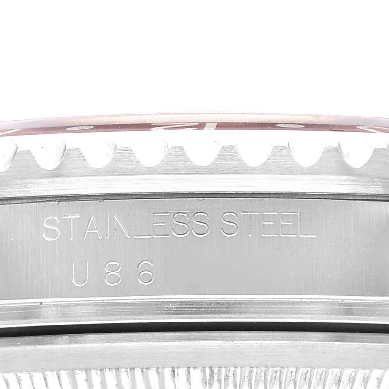 This close-up image shows the side of a Rolex GMT-Master 16710 Men
s Stainless Steel Black Dial 16710 Men
s Stainless Steel Black Dial watch, featuring the stainless steel inscription and part of the bezel
s edge.