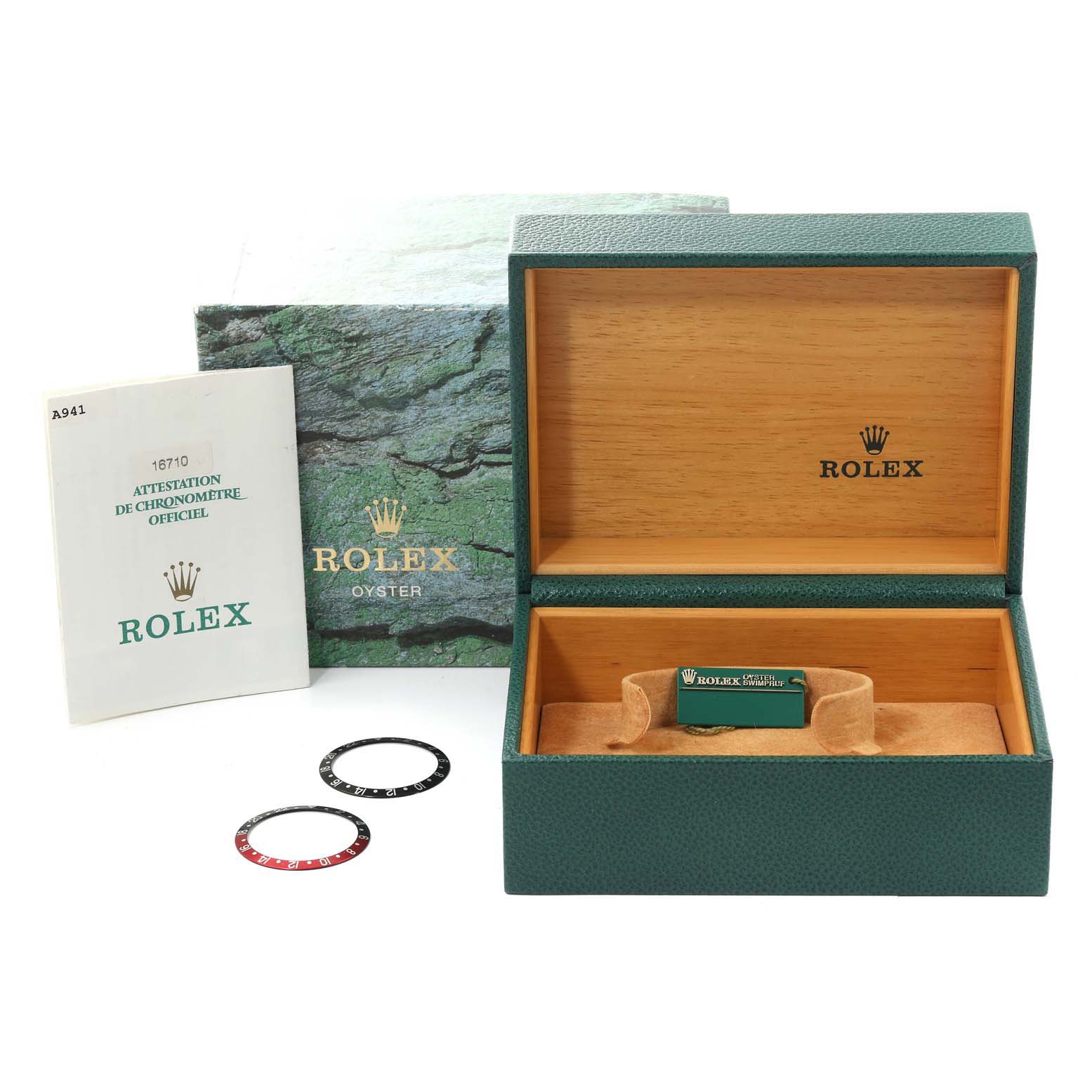 The image shows an open box set for a Rolex GMT-Master 16710 Men
s Stainless Steel Black Dial 16710 Men
s Stainless Steel Black Dial, including the watch box, outer box, two bezels, and a manual.