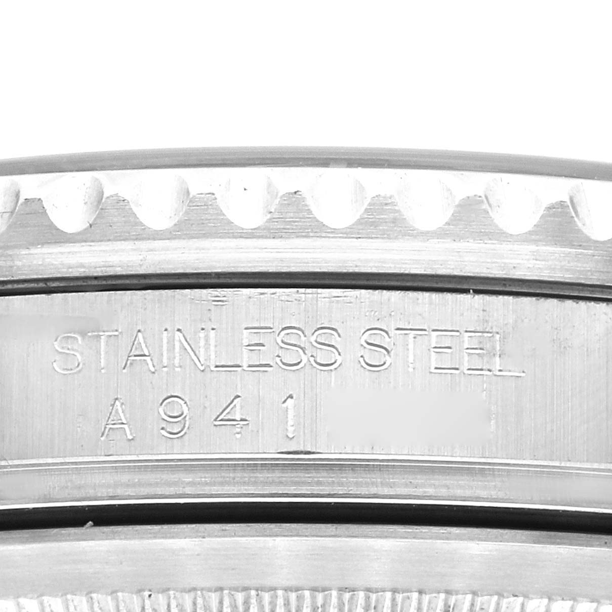 This image shows a close-up of the engraved stainless steel case back of a Rolex GMT-Master 16710 Men
s Stainless Steel Black Dial 16710 Men
s Stainless Steel Black Dial watch.