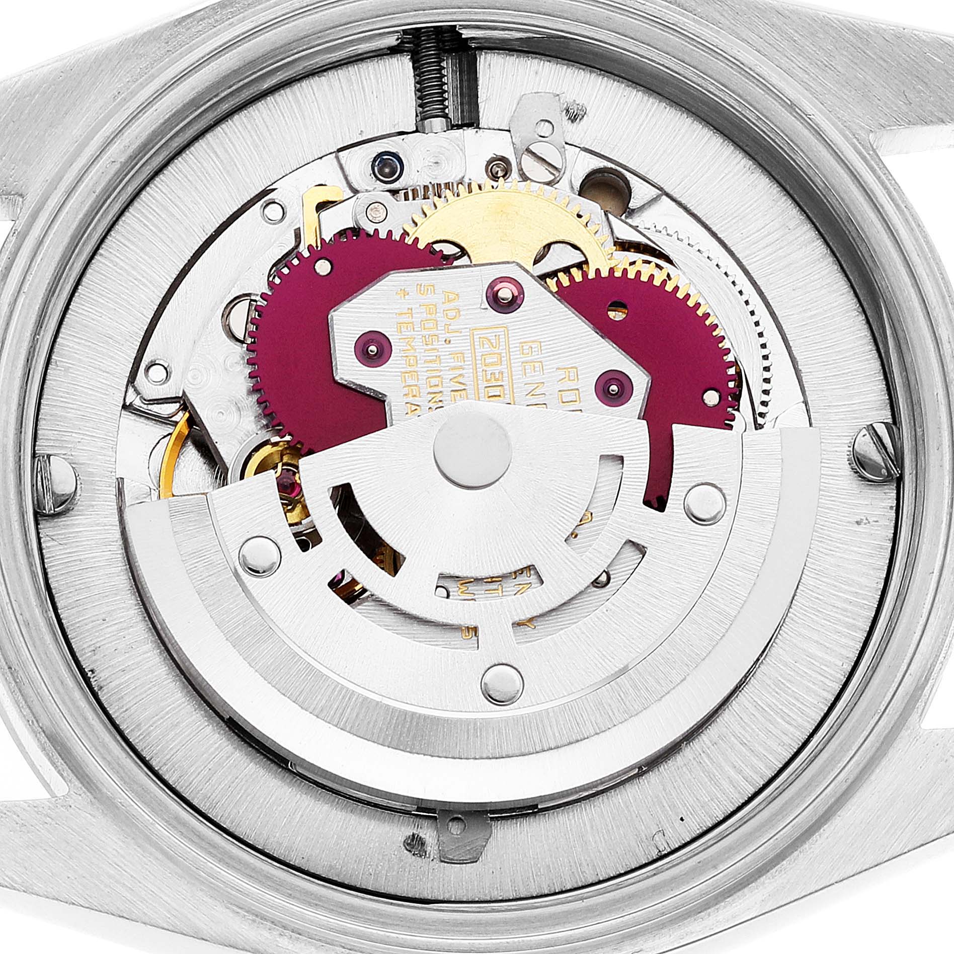 This image shows the internal movement mechanism of a Mid-Size Rolex watch from a rear angle.