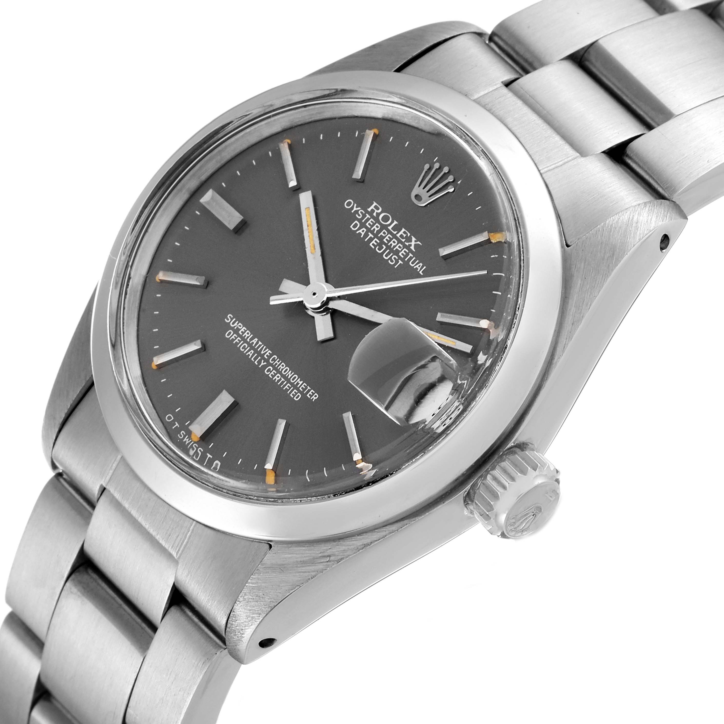 The image shows a side angle of the Rolex Mid-Size 6824 Women's Stainless Steel Grey Dial 6824 Women's Stainless Steel Grey Dial Datejust, featuring the dial, bracelet, case, and crown.