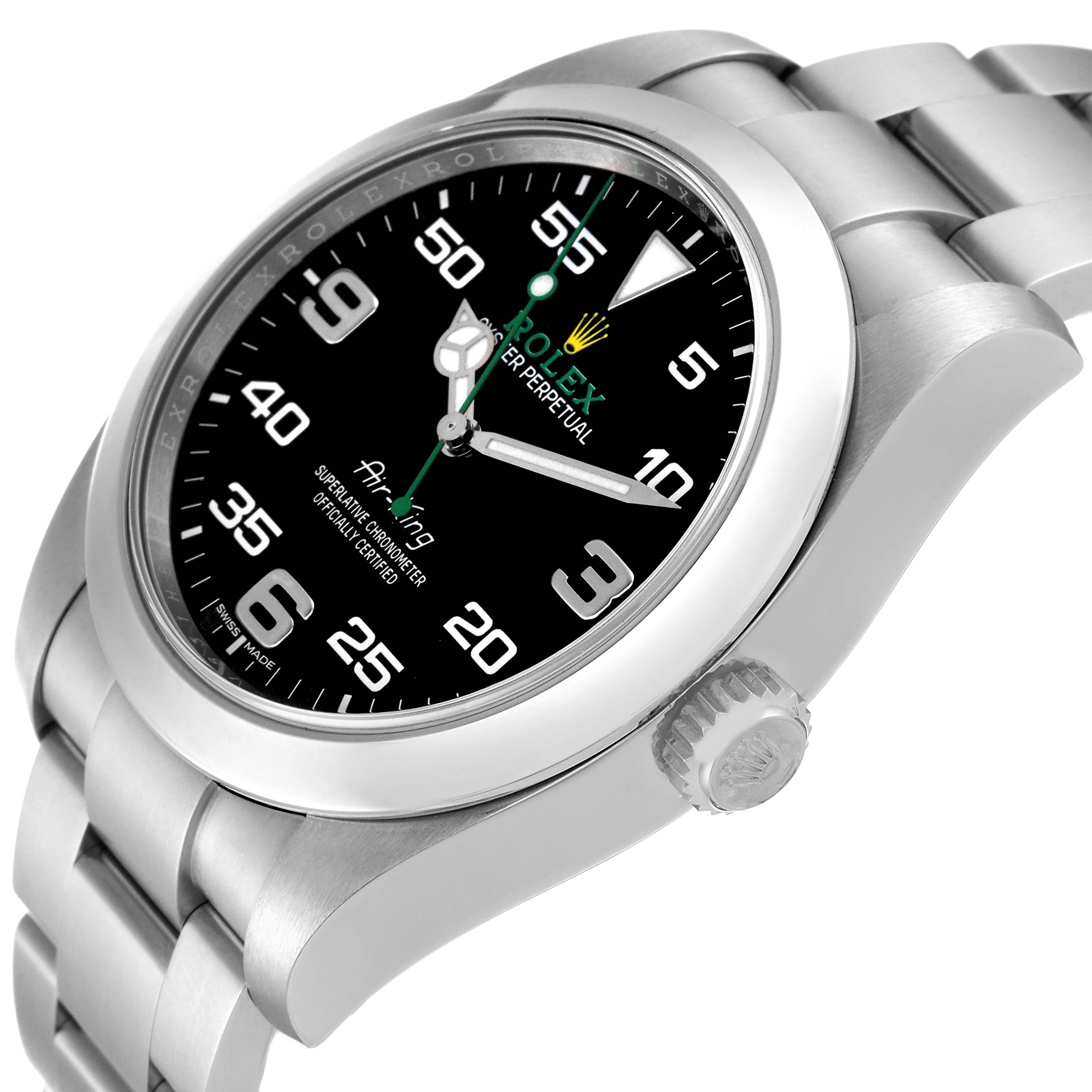 The image shows a close-up, side angle of a Rolex Air-King 116900 Men's Stainless Steel Black Dial 116900 Men's Stainless Steel Black Dial watch, detailing the dial, crown, and part of the bracelet.