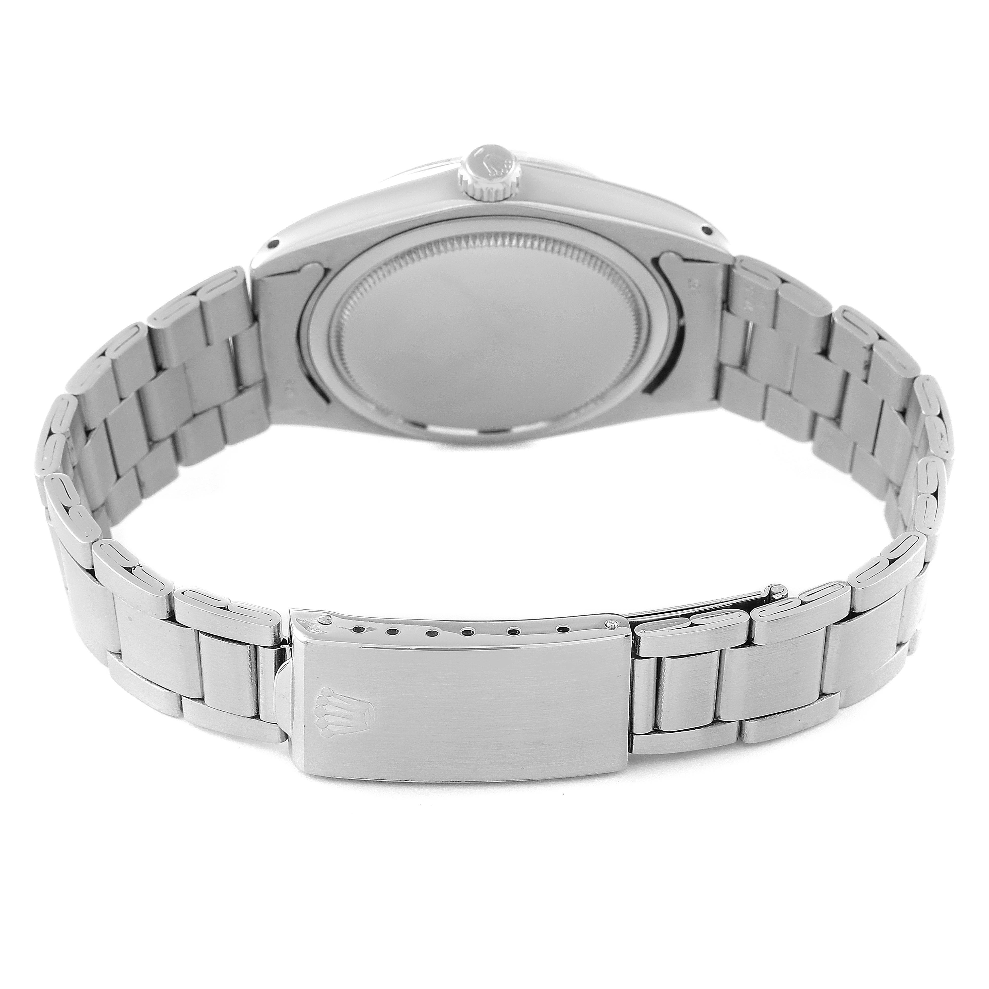 The image shows the back case and bracelet clasp of a Rolex Vintage Collection 6694 Men's Stainless Steel Black Dial 6694 Men's Stainless Steel Black Dial watch.