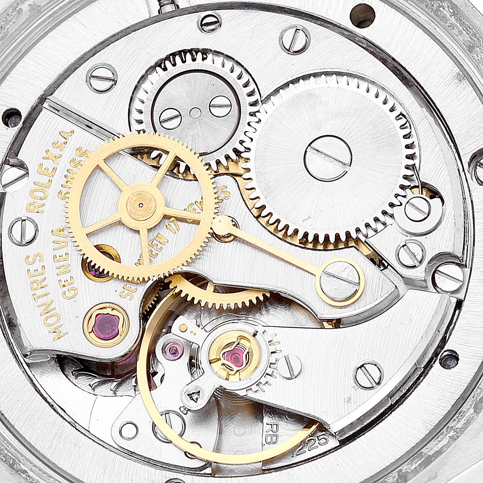 The image shows an internal view of the movement gears and intricate mechanics of a Rolex Vintage Collection 6694 Men's Stainless Steel Blue Dial 6694 Men's Stainless Steel Blue Dial model watch.