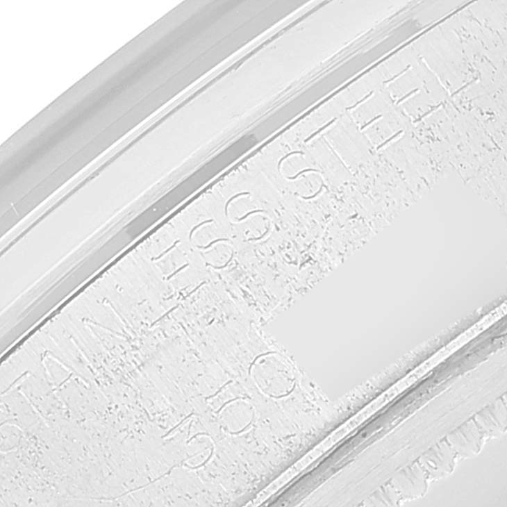 This image shows an extreme close-up of the engraved text on the stainless steel case back of a Rolex Vintage Collection 6694 Men's Stainless Steel Blue Dial 6694 Men's Stainless Steel Blue Dial model.