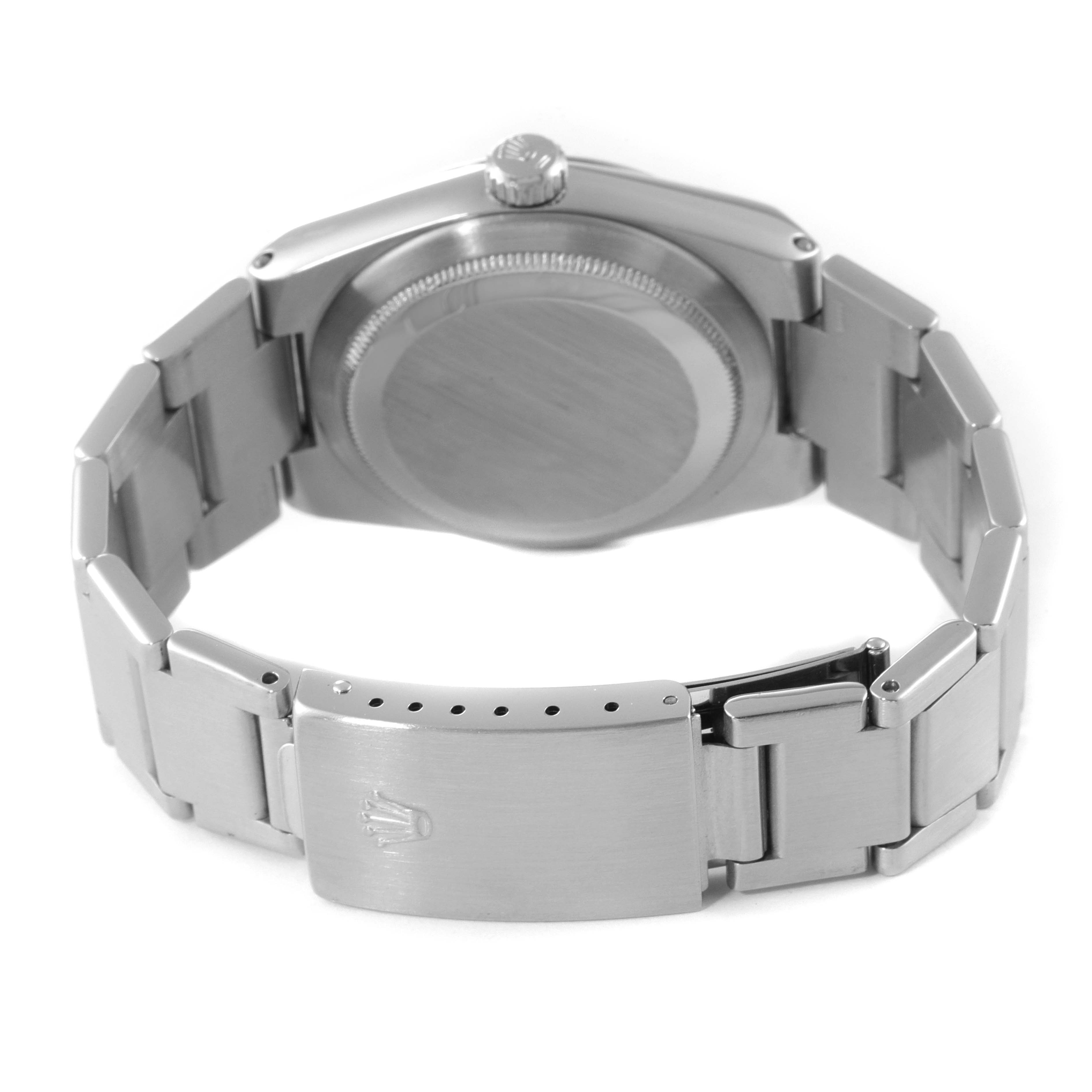 The image shows the back view of a Rolex Oysterquartz 17000 Men's Stainless Steel Silver Dial 17000 Men's Stainless Steel Silver Dial watch, highlighting the clasp, bracelet links, and the screw-down crown.