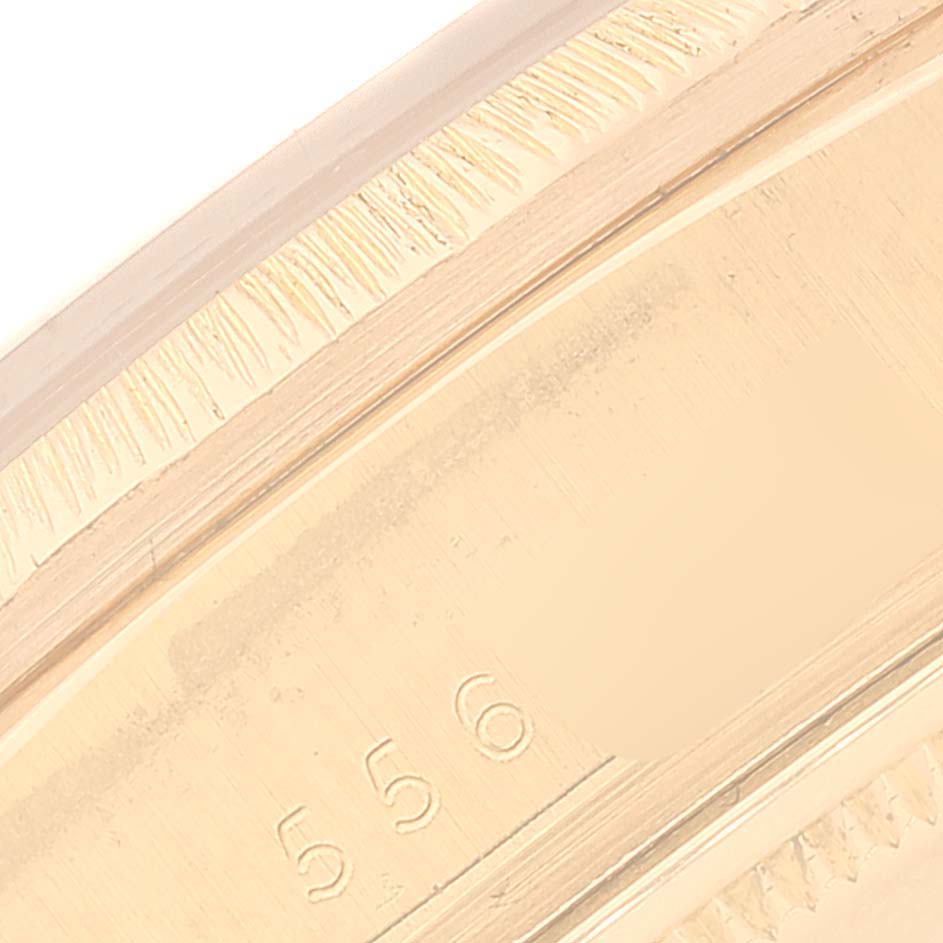 This close-up image shows the side of a Rolex President 18078 Men
s Yellow Gold Silver Dial 18078 Men
s Yellow Gold Silver Dial model watch, focusing on the detailing and markings.