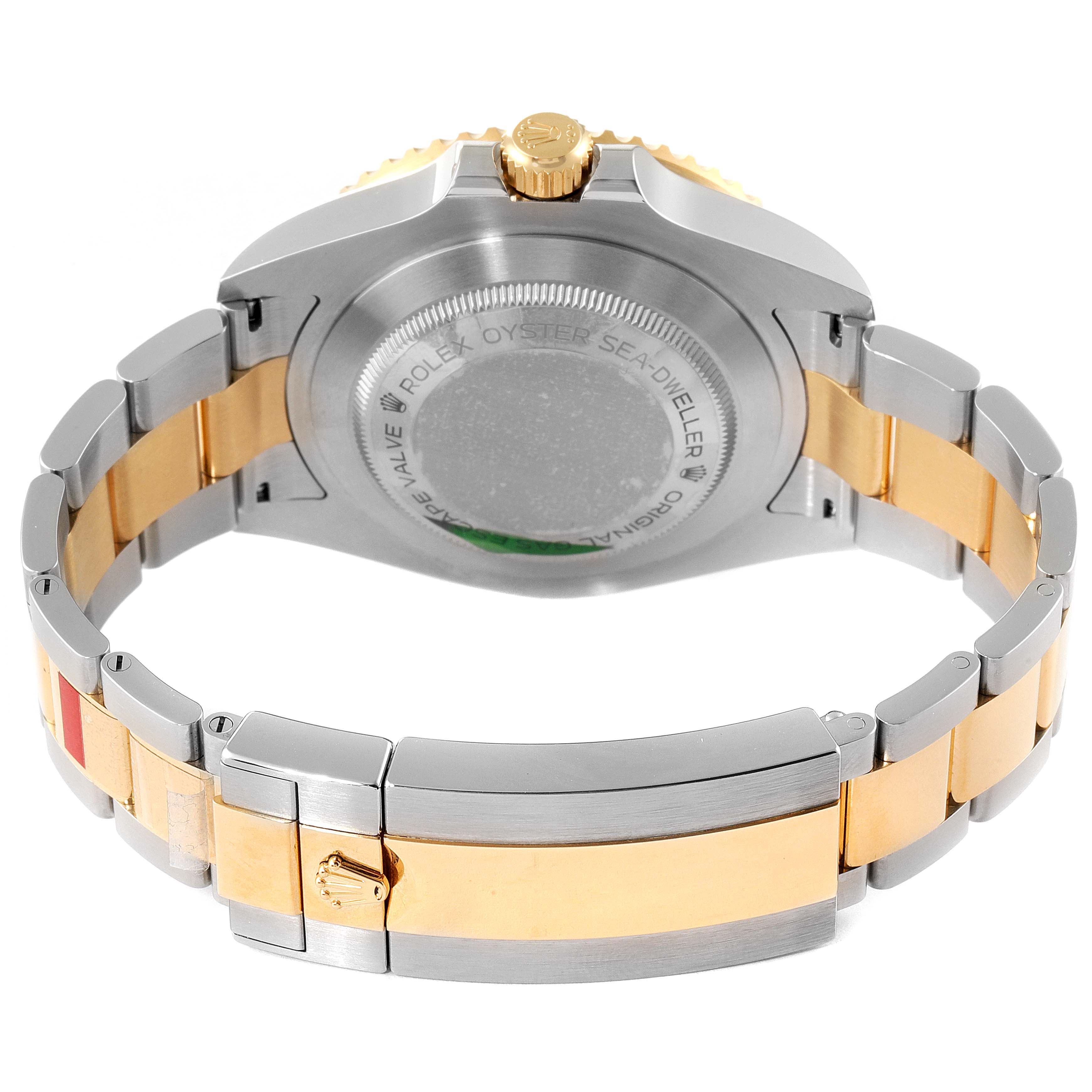 This image shows the back case and bracelet of a Rolex Sea-Dweller 126603 Men's Steel and Gold (two tone) Black Dial 126603 Men's Steel and Gold (two tone) Black Dial watch, including the crown and clasp.