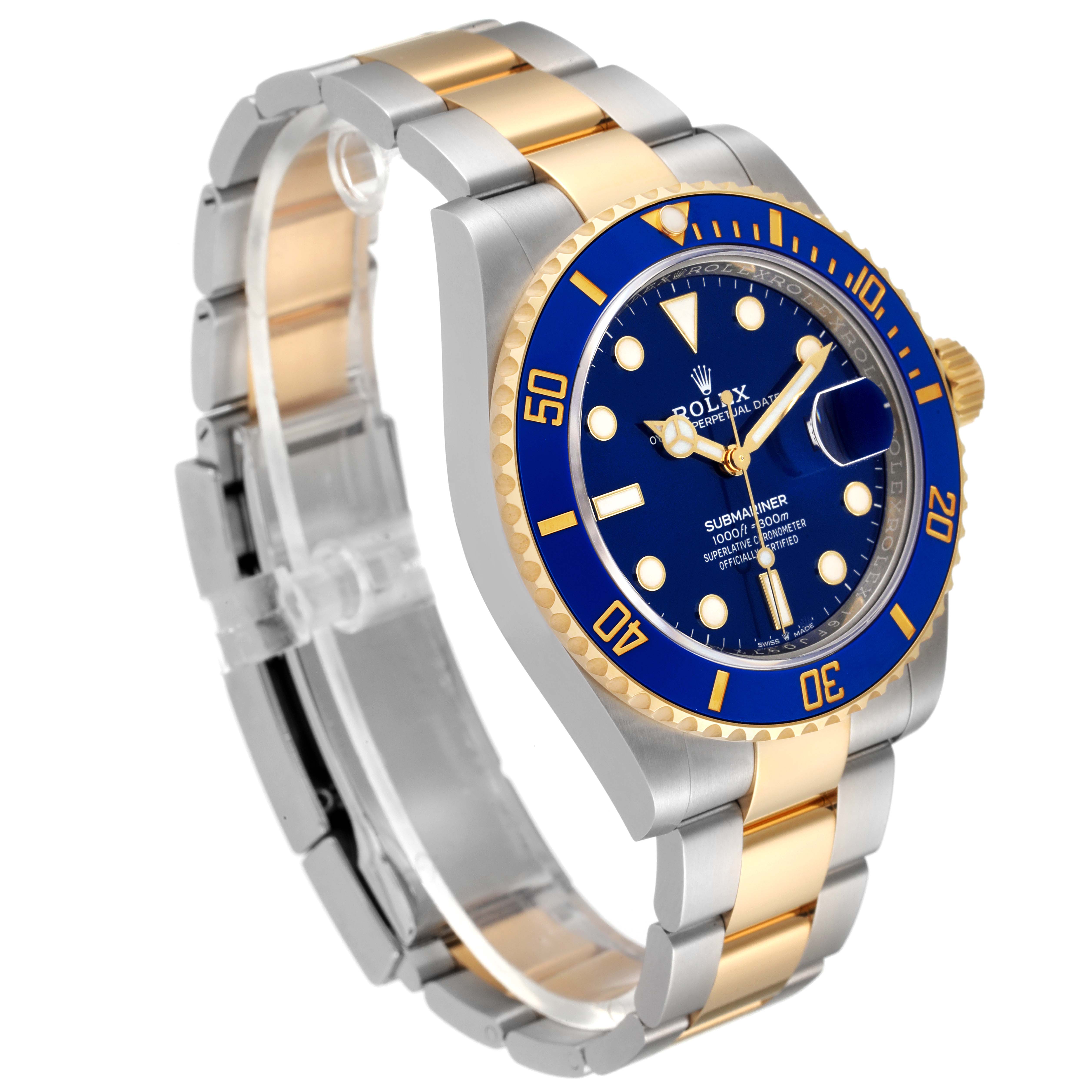 The image shows a Rolex Submariner 126613 Men's Steel and Gold (two tone) Blue Dial 126613 Men's Steel and Gold (two tone) Blue Dial watch from an angled side view, highlighting the blue dial, bezel, and two-tone bracelet.