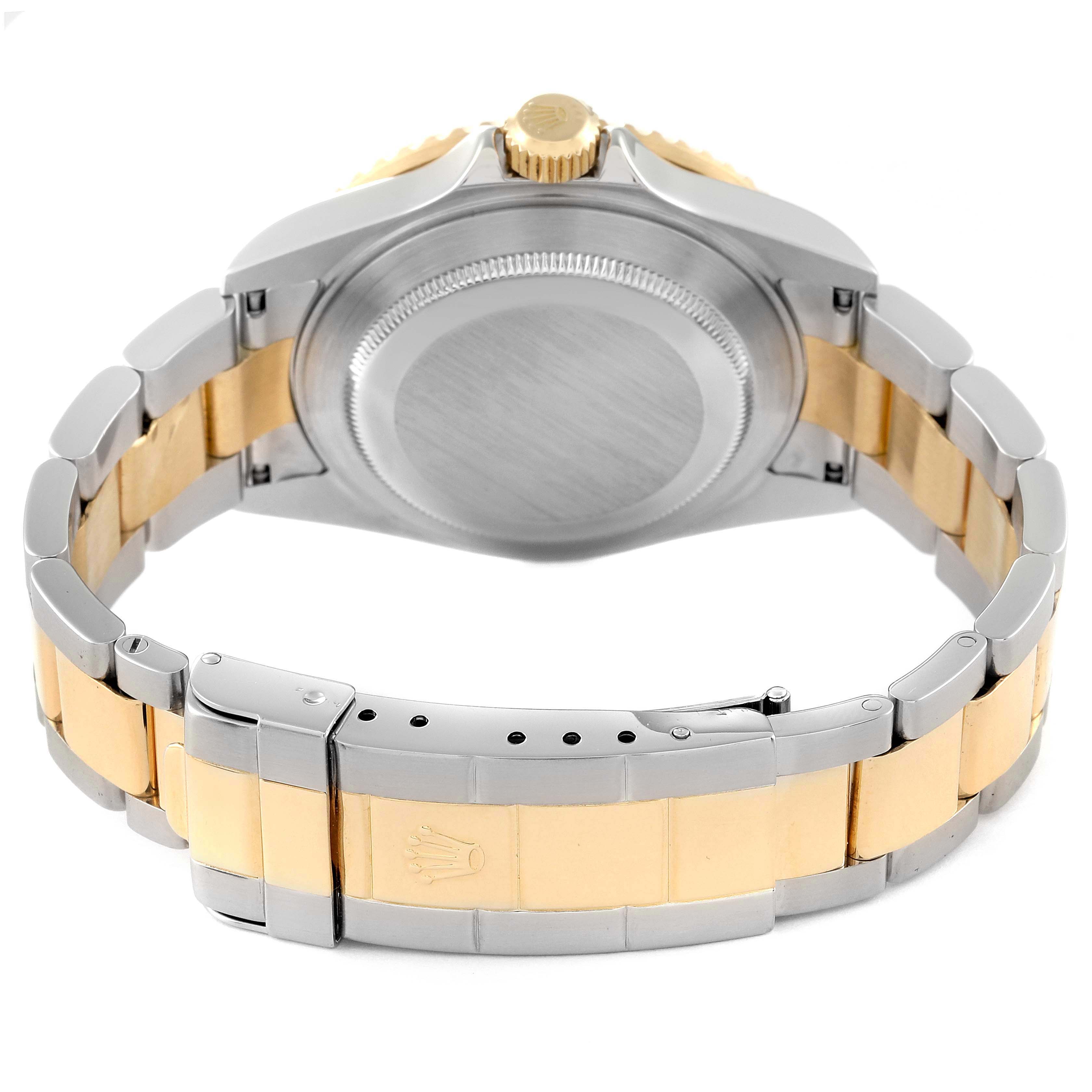 This image shows the back view of a Rolex Submariner 16613 Men
s Stainless Steel Blue Dial 16613 Men
s Stainless Steel Blue Dial, focusing on the case back and two-tone metal bracelet.