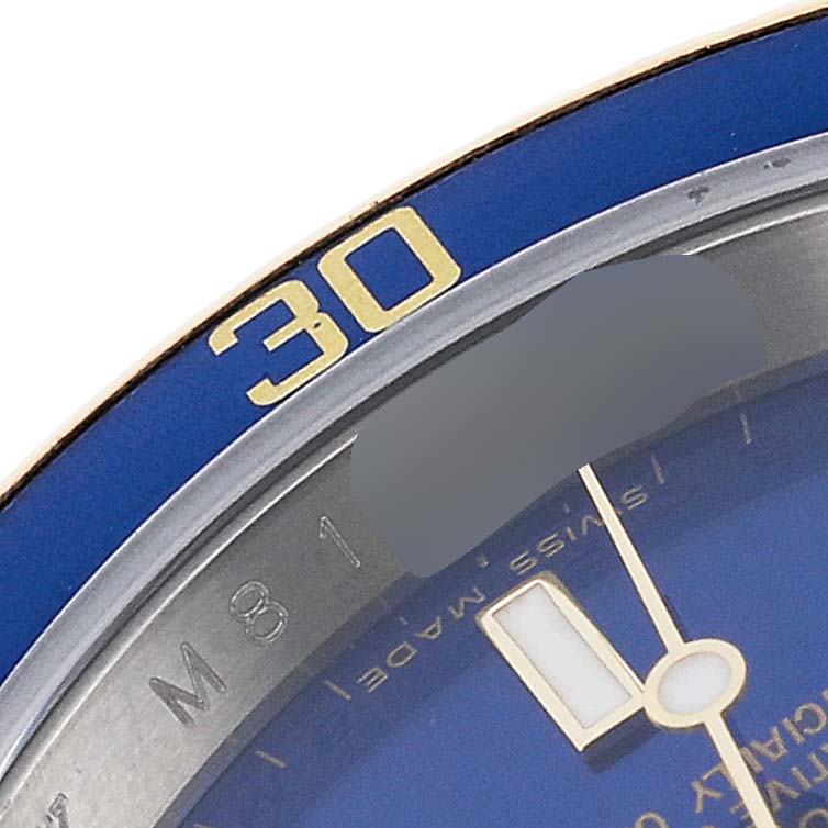 This image shows a close-up of the blue bezel and the minute hand of the Rolex Submariner 16613 Men
s Stainless Steel Blue Dial 16613 Men
s Stainless Steel Blue Dial watch. 