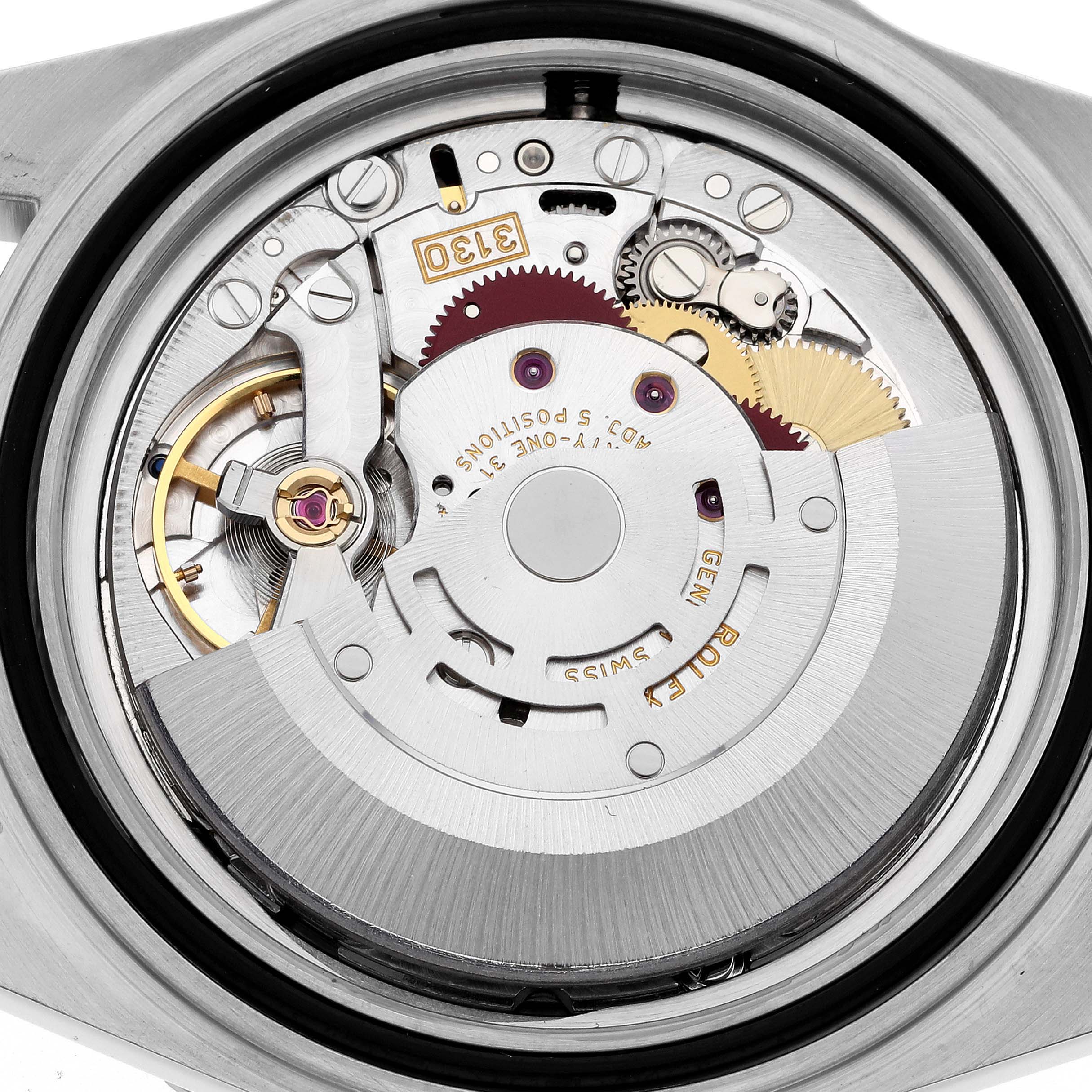 The image shows the Rolex Submariner 14060 Men
s Stainless Steel Black Dial 14060 Men
s Stainless Steel Black Dial watch
s movement from a rear, open caseback angle, revealing internal mechanical parts.