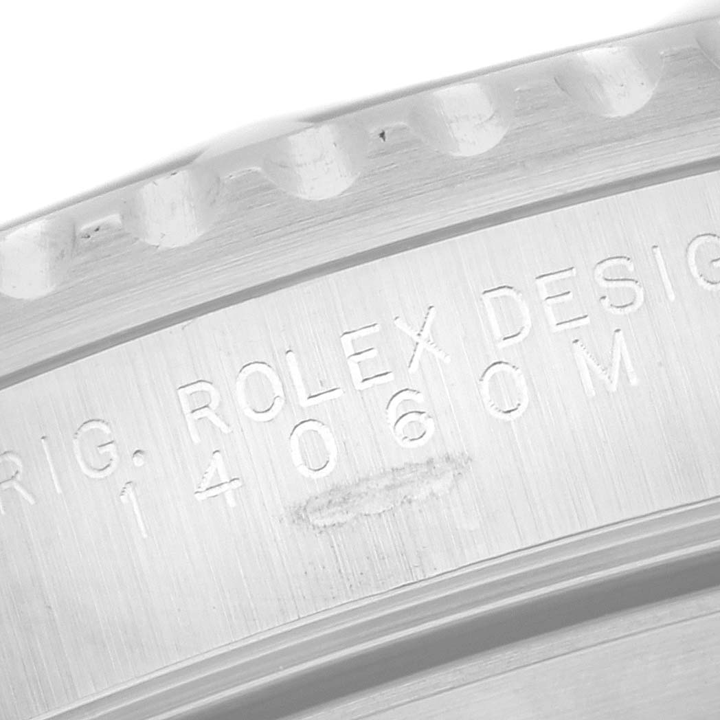 This close-up image shows the engraved case back and model number of the Rolex Submariner 14060 Men
s Stainless Steel Black Dial 14060 Men
s Stainless Steel Black Dial.