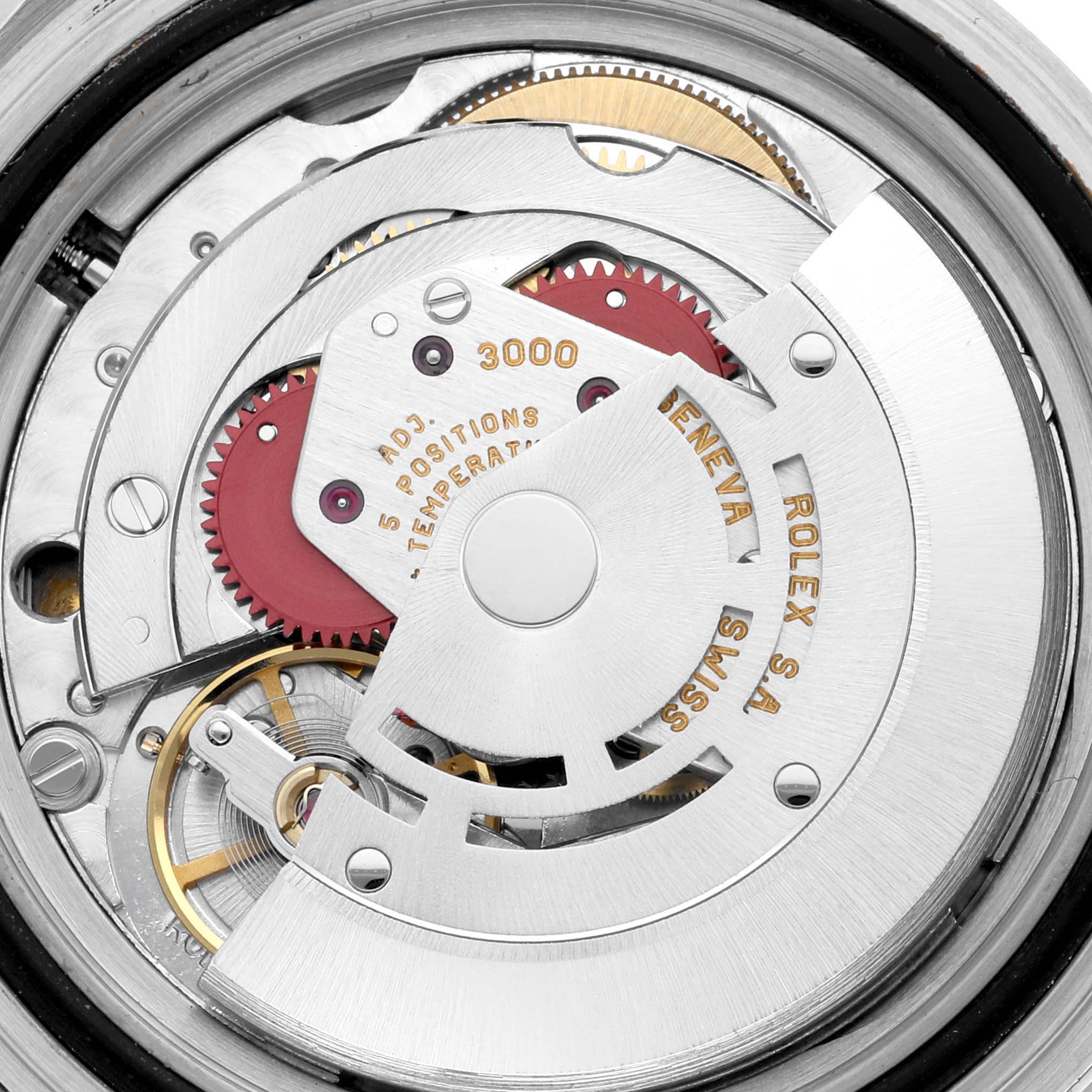 The image shows a close-up of the movement of the Rolex Submariner 14060 Men
s Stainless Steel Black Dial 14060 Men
s Stainless Steel Black Dial watch, highlighting its intricate internal mechanics.