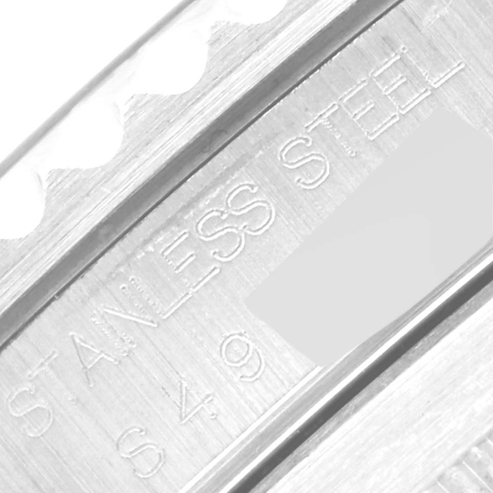 The image shows a close-up of the side of the bezel and case of a Rolex Submariner 14060 Men
s Stainless Steel Black Dial 14060 Men
s Stainless Steel Black Dial, highlighting the "STAINLESS STEEL" engraving.