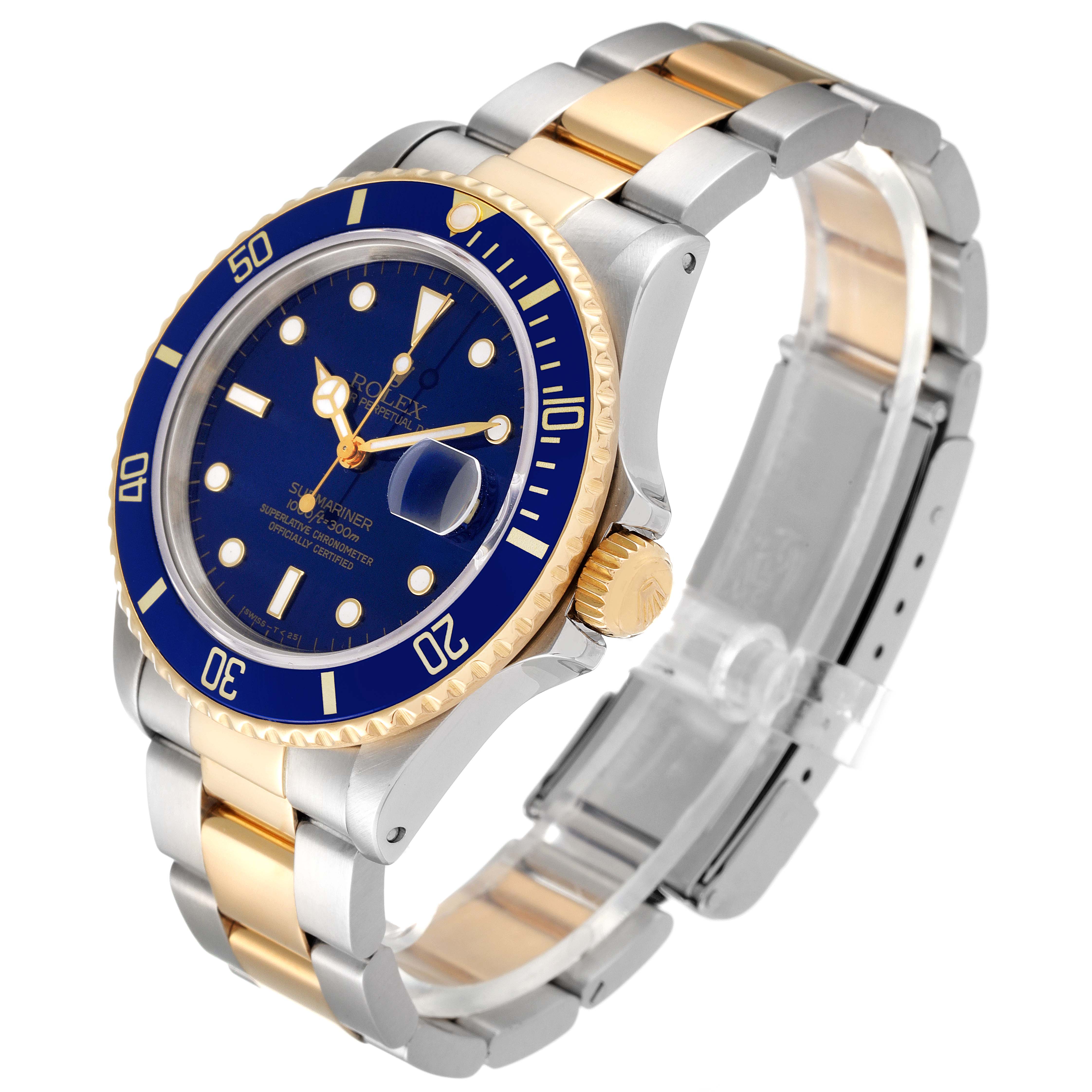 This is a Rolex Submariner 16803 Men
s Steel and Gold (two tone) Blue Dial 16803 Men
s Steel and Gold (two tone) Blue Dial model watch shown at a slight angle, highlighting the dial, bezel, bracelet, and crown.